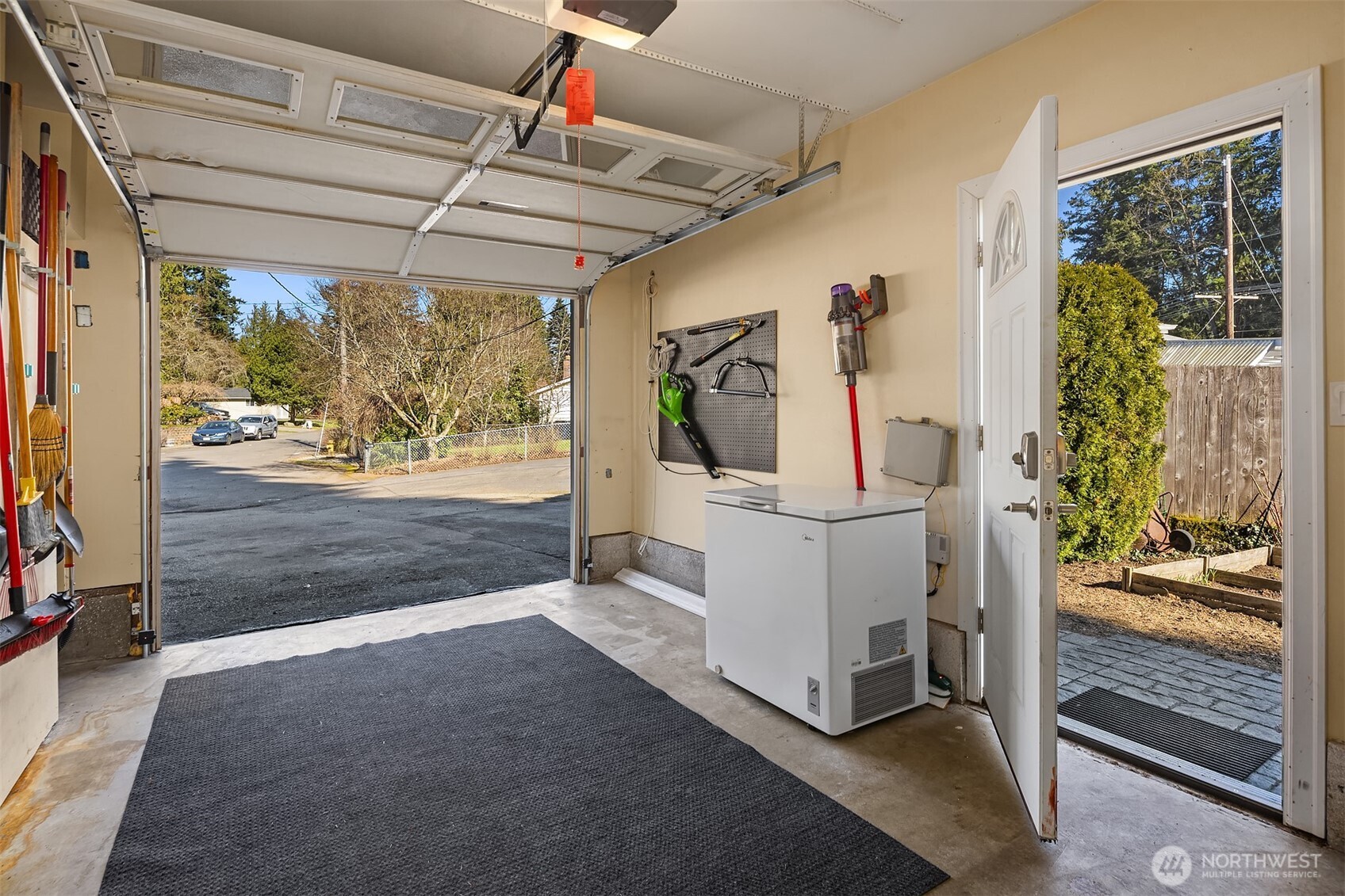 Spacious garage with direct access to the backyard.