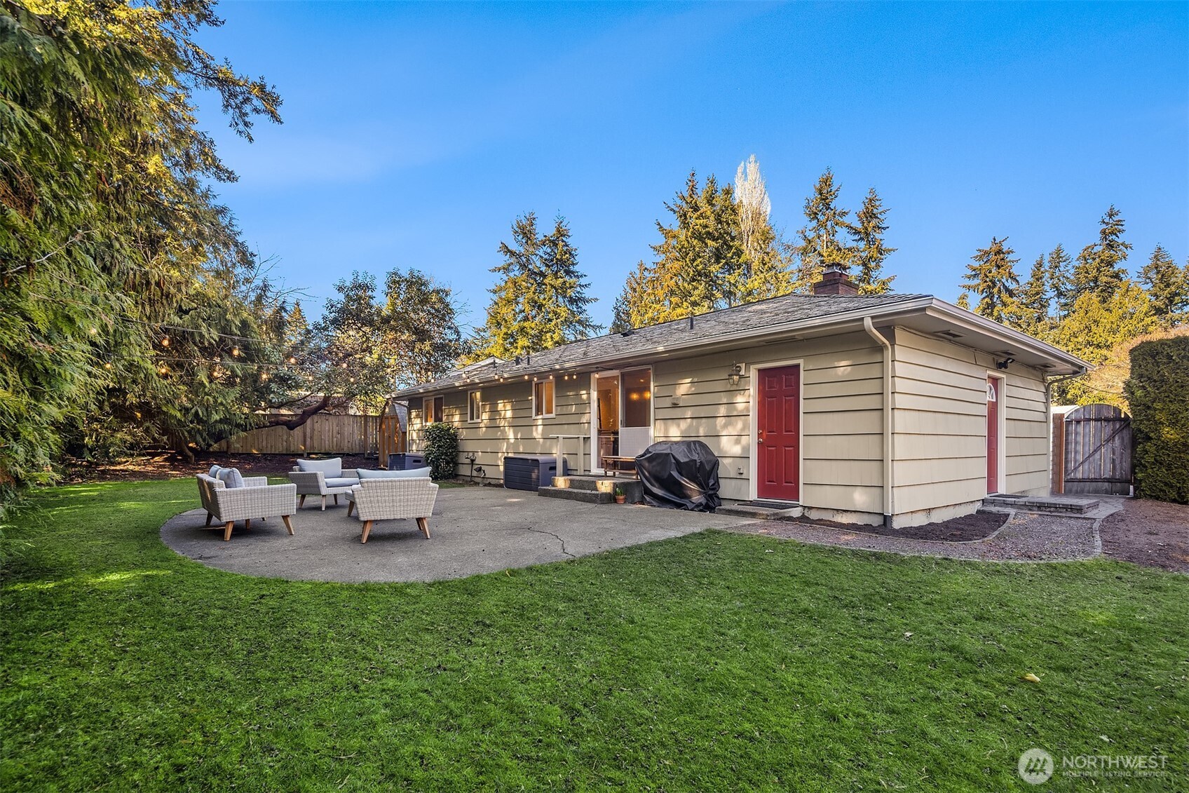 Spacious backyard surrounded by lush greenery and privacy.