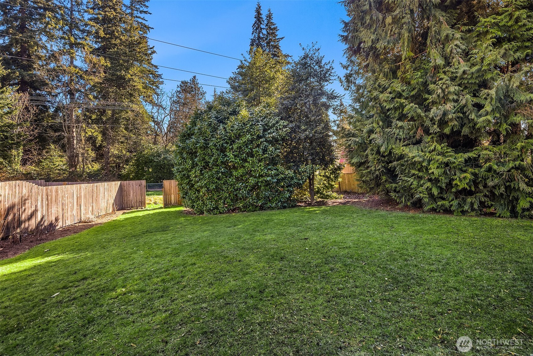 Backyard featuring gate access to Interurban Trail.