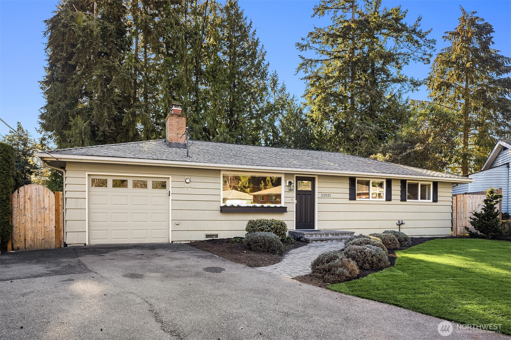 Front of home showing garage and 2 off-street parking spots in the driveway.