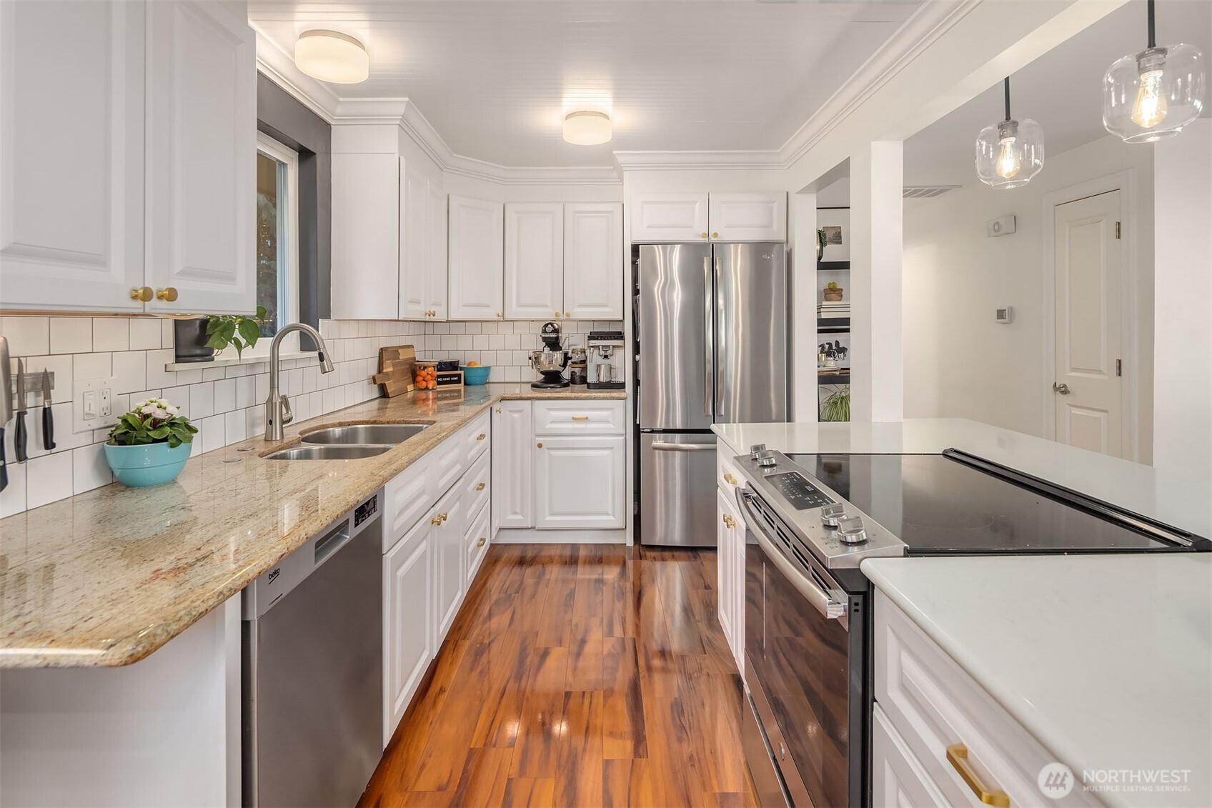 Functional kitchen with sleek countertops and high-end appliances.