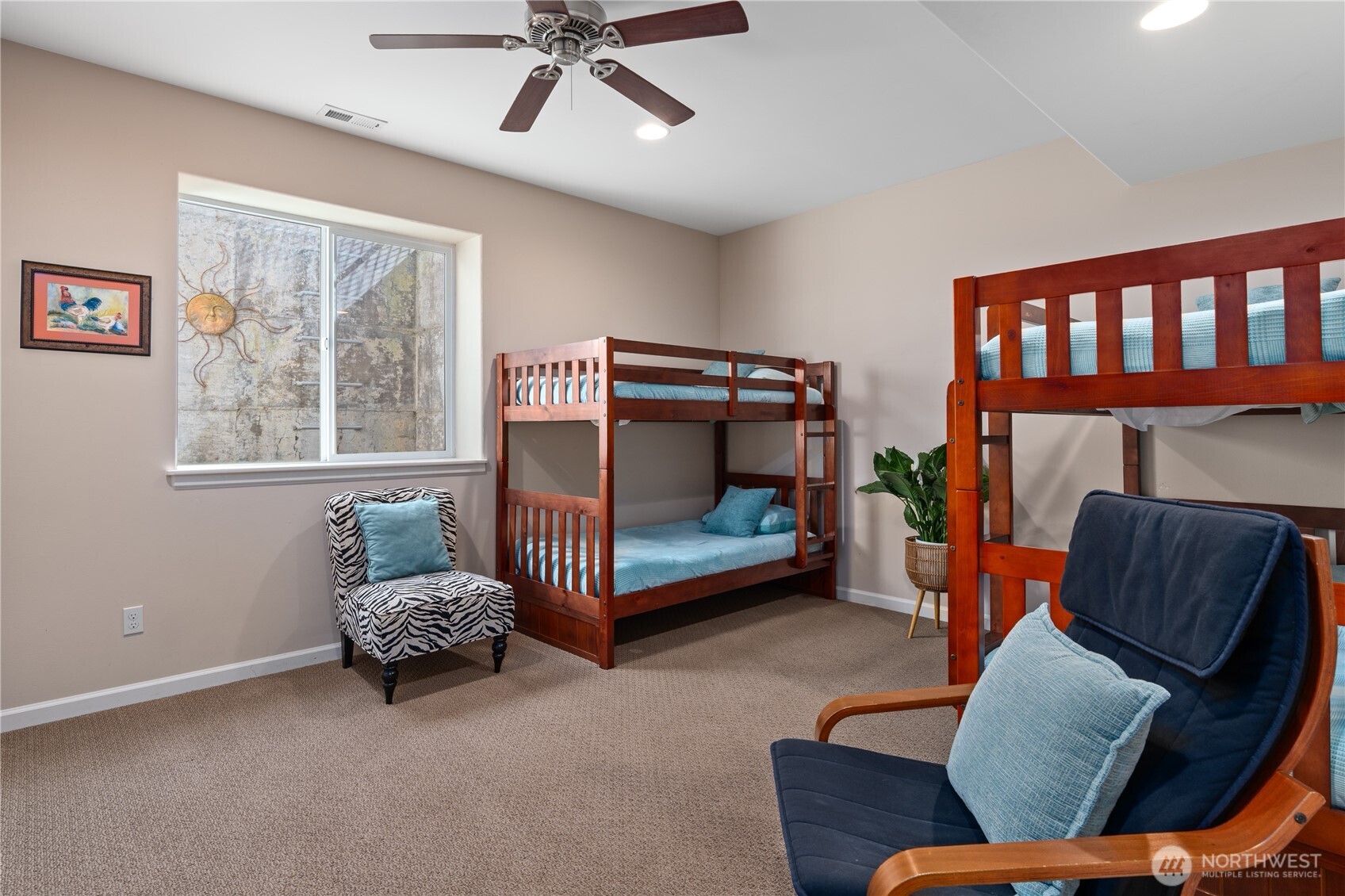 View of lower level bedroom 4 with bunk beds.
