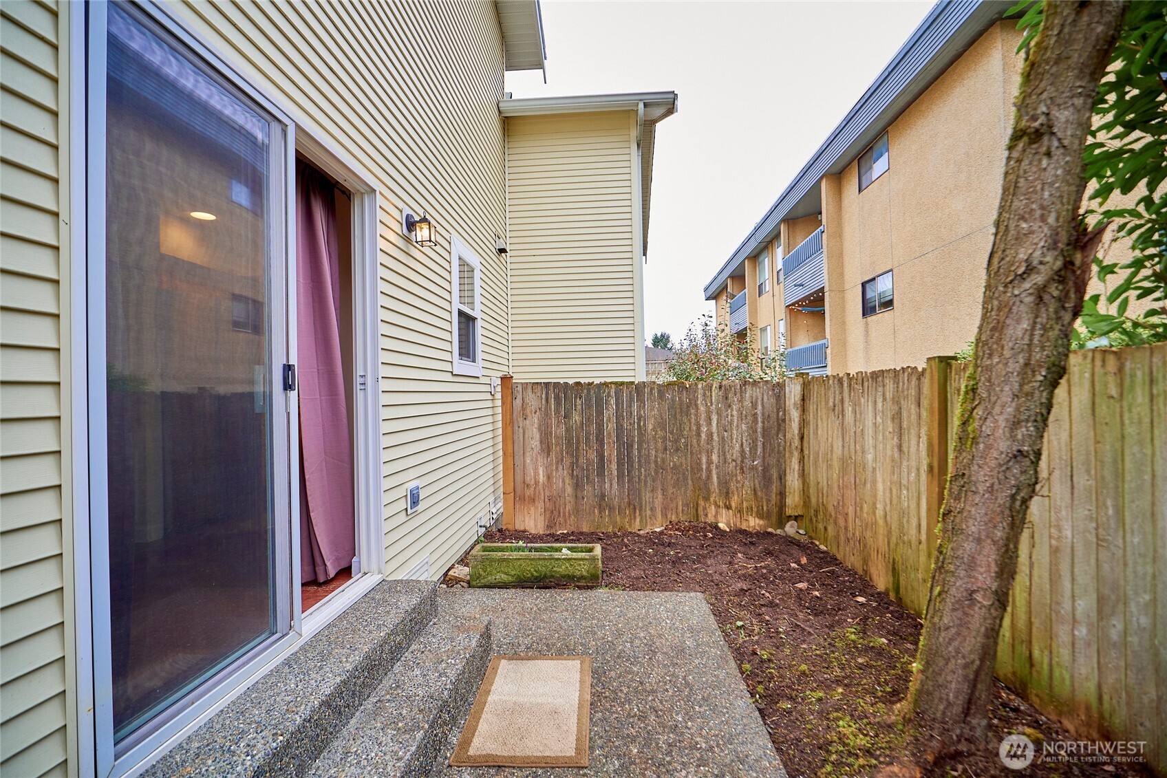 Here's a look at the patio and fenced back yard. One could easily extend the patio area with some pavers and create a very cute backyard area.