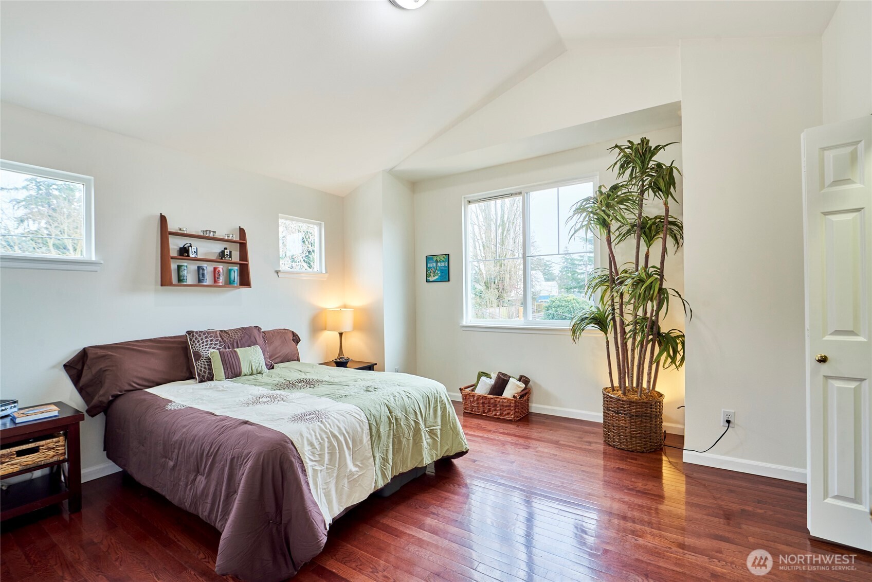 Look at the size of this bedroom! This is one of the largest bedrooms you'll ever see in a townhome... period! It boasts a cathedral ceiling, large window for great light, gleaming Cherry hardwood floors and a very spacious closet.