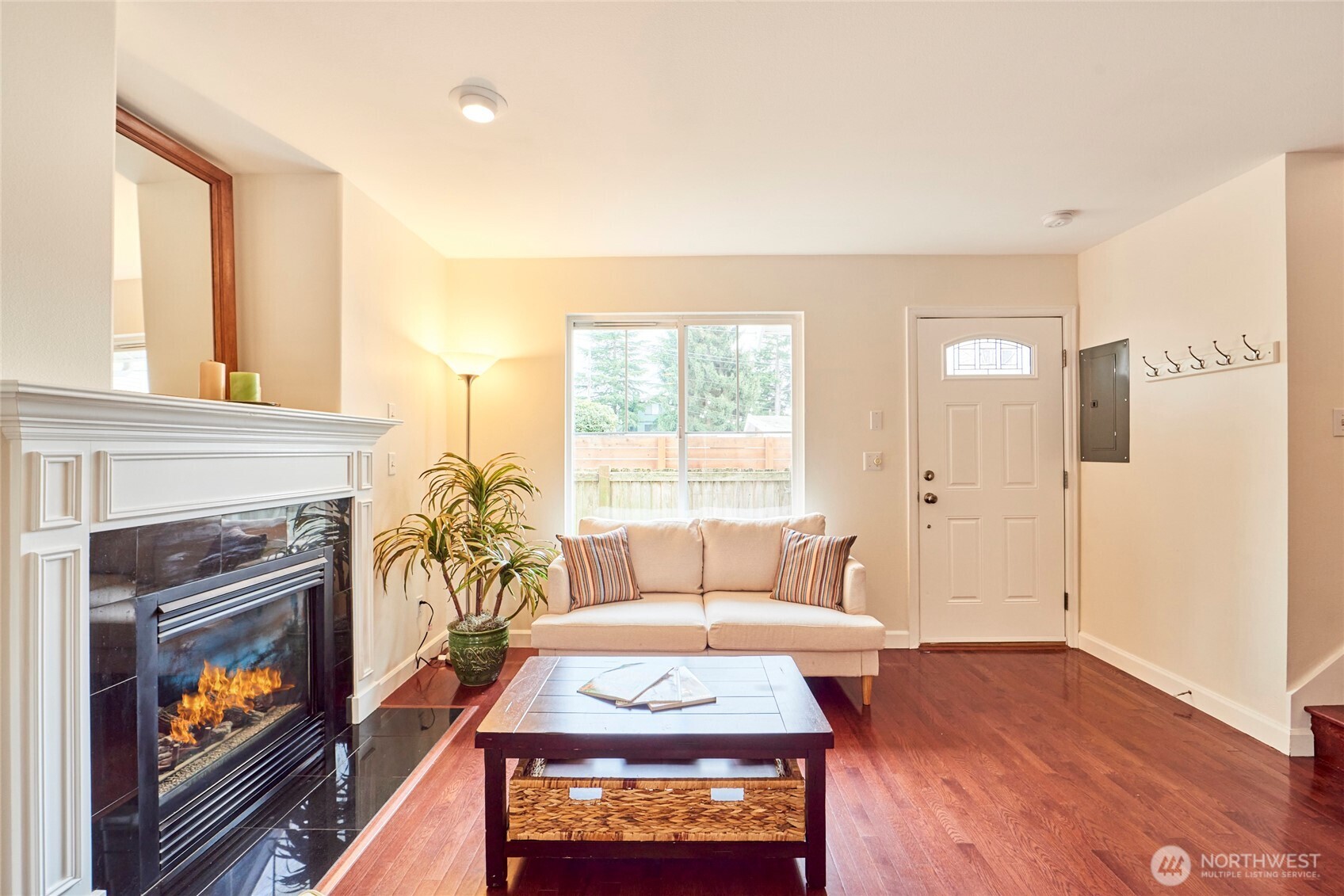 There's both a coat rack near the front door and a coat & storage closet under the stairs.