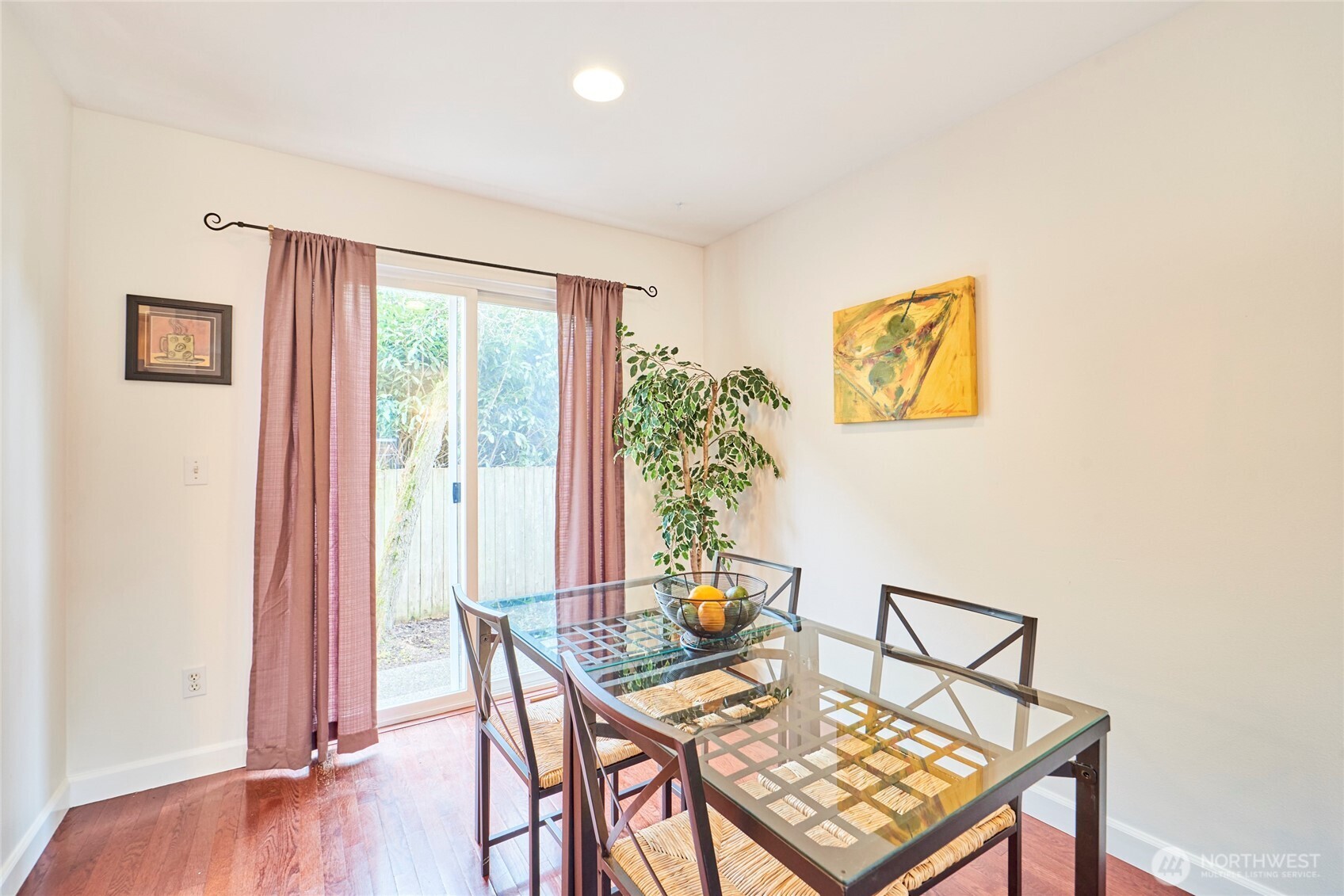 The dining area is quite spacious with a slider that leads to the back patio and fenced yard.