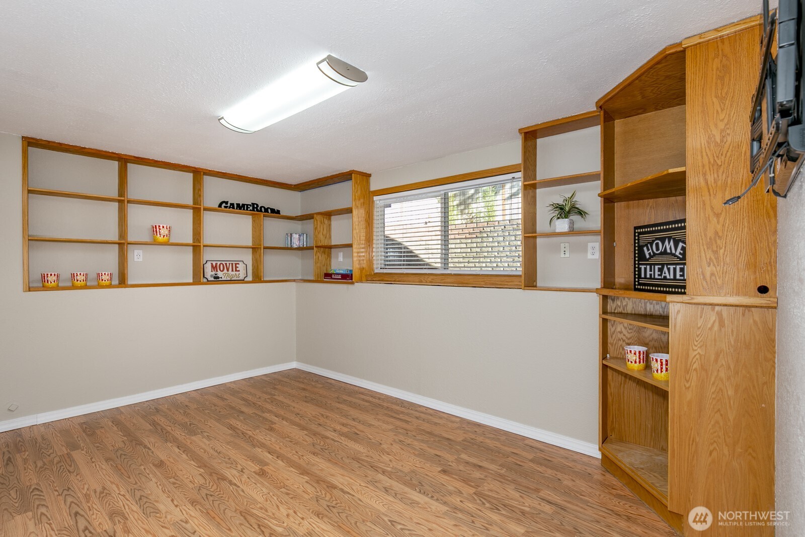 Spacious lower Bonus room is ready for endless fun! Lots of storage shelves for games, movies etc.