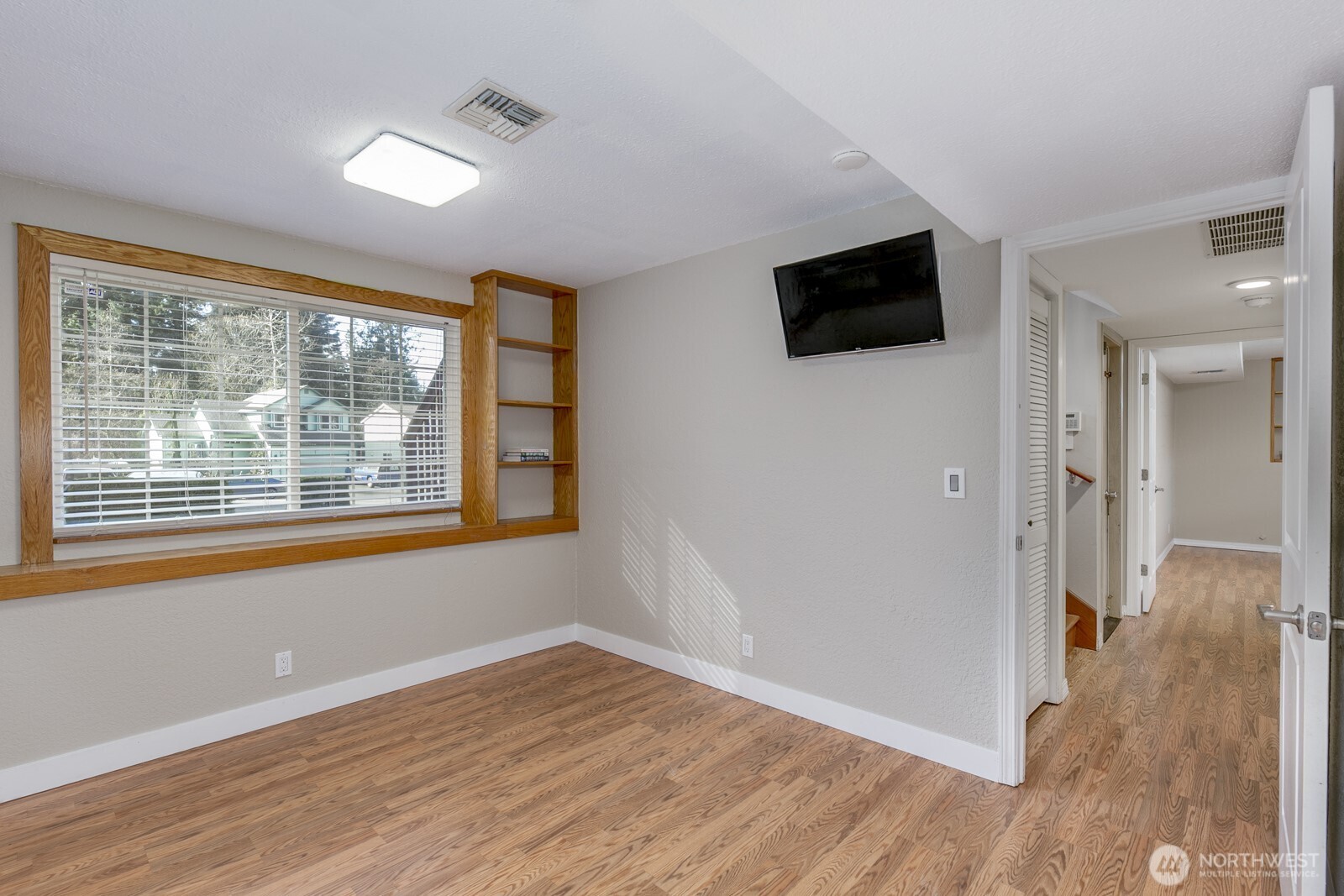 Deluxe laundry room with built-in shelves.