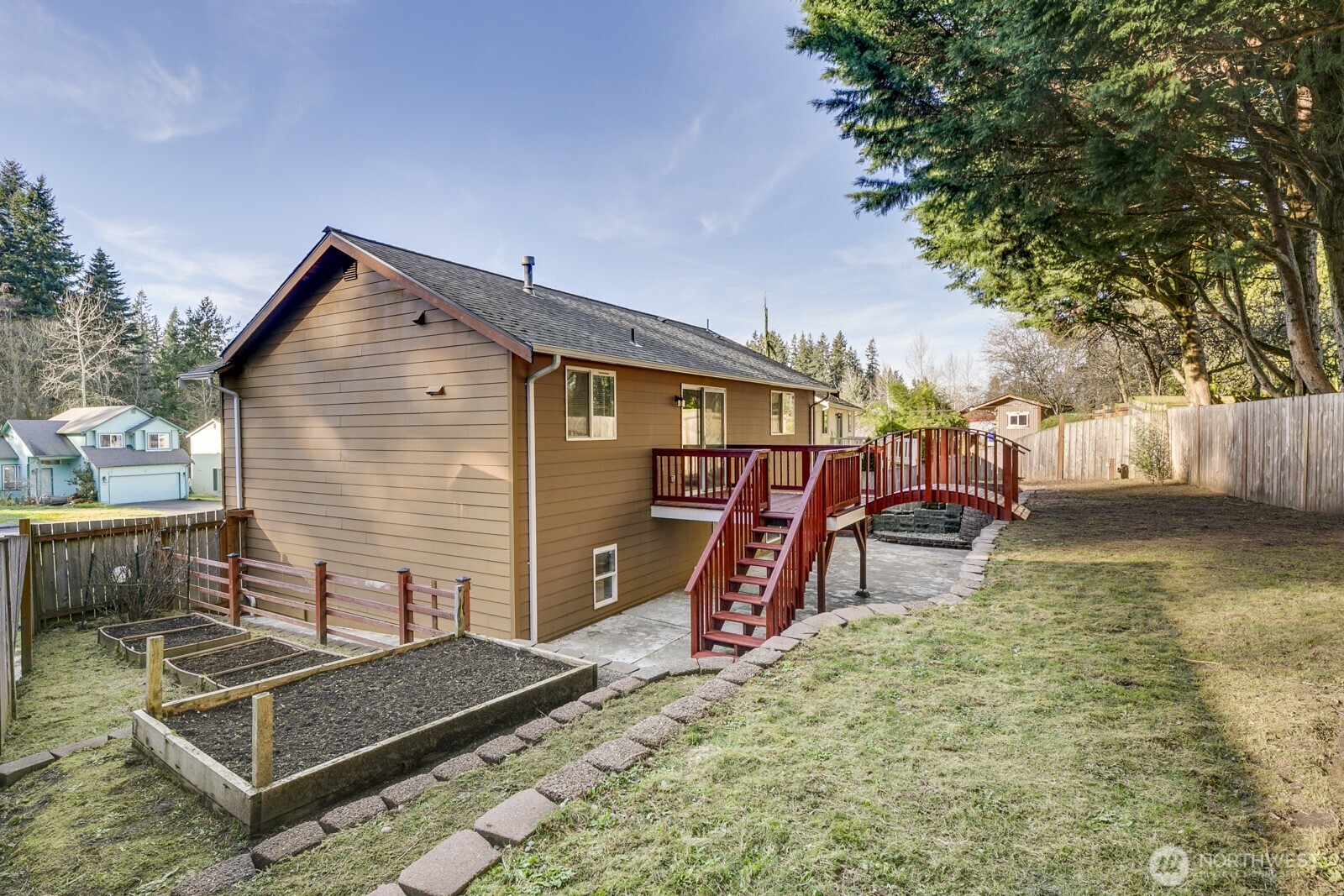 Freshly stained deck leads to a huge lower patio.  A perfect set up for a bball hoop or future hot tub!