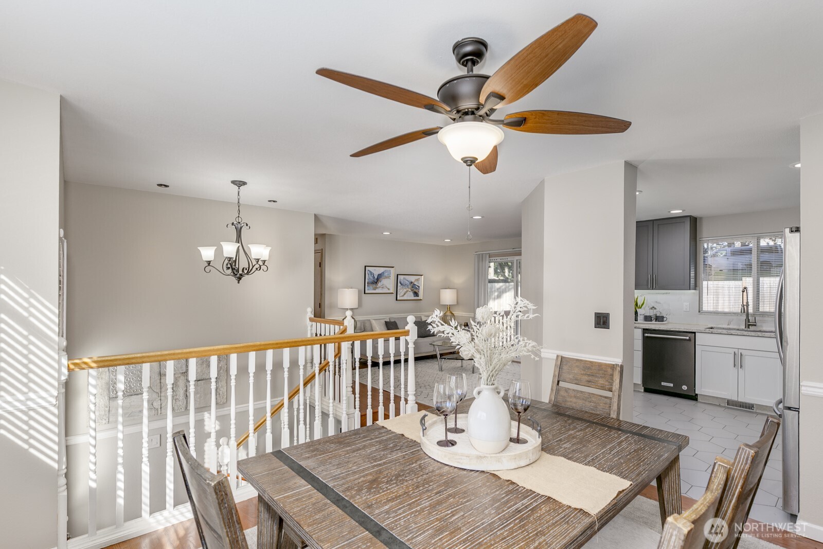 Bright & cheery dining room with ceiling fan.