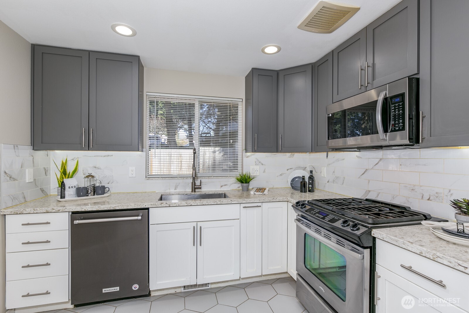 Beautifully upgraded kitchen.  Accent lighting and heated floor!  All appliances included!