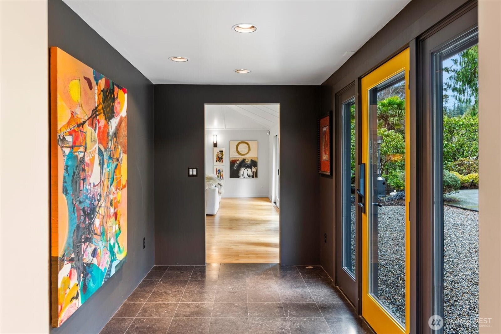 Gallery foyer with limestone floors creates a focal point and welcomes your guests.