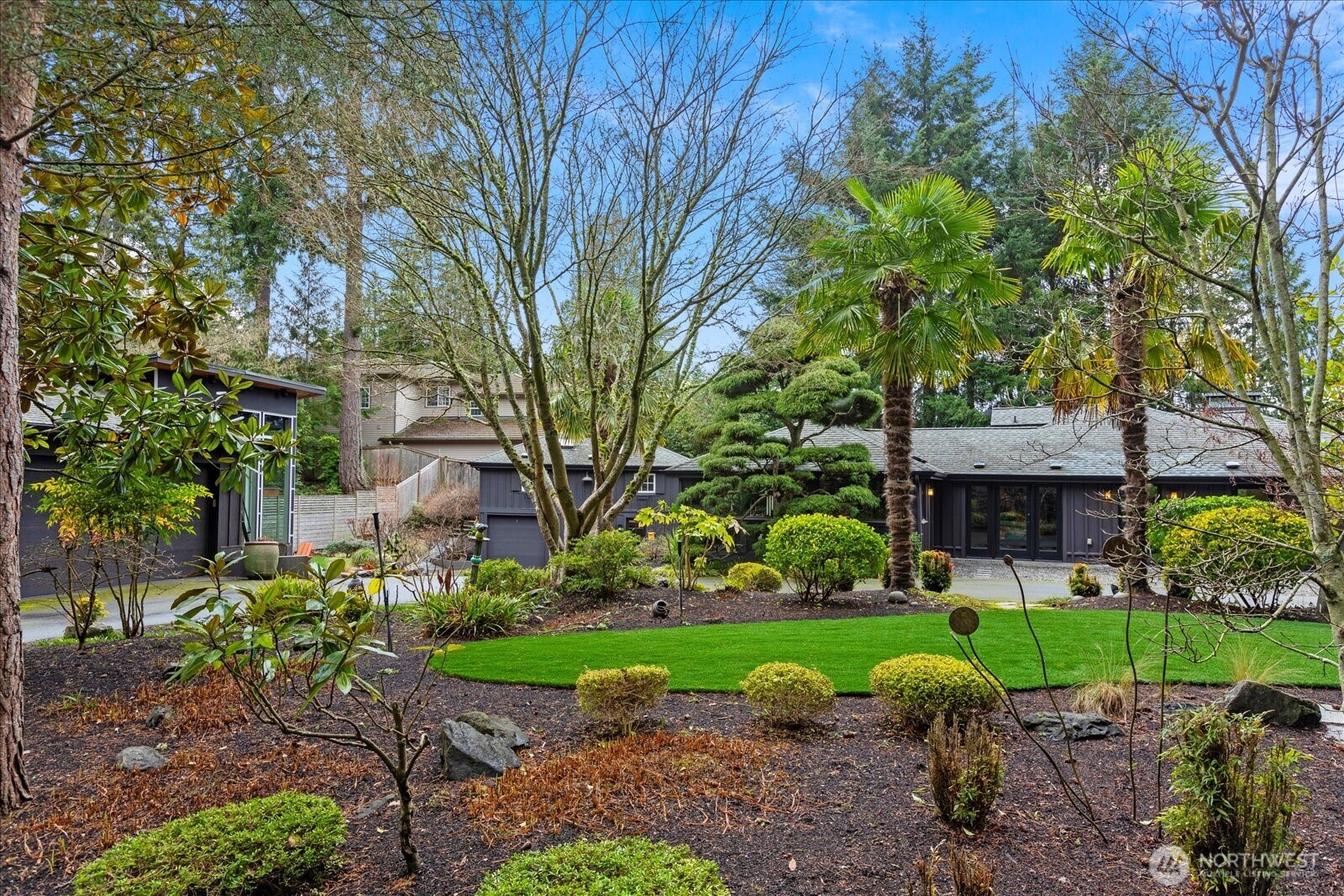 Edmonds in Bloom featured property. From left to right: 2 car garage with studio, carriage house, and main residence.