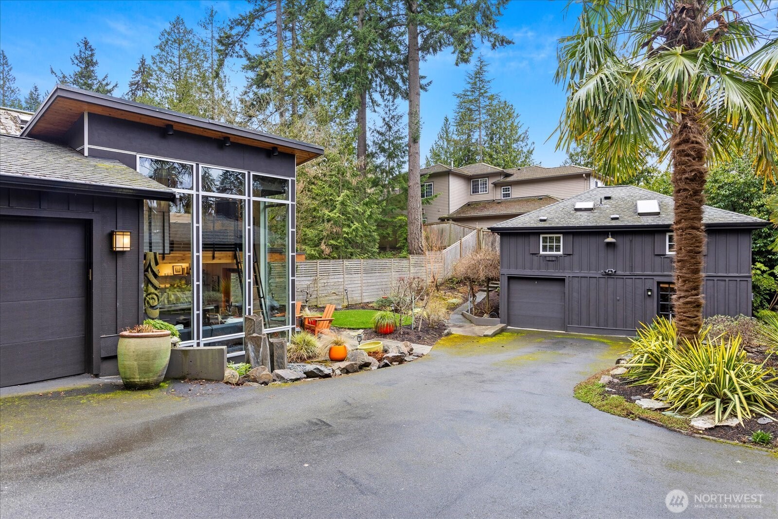 Studio + two car garage on left and carriage house on right