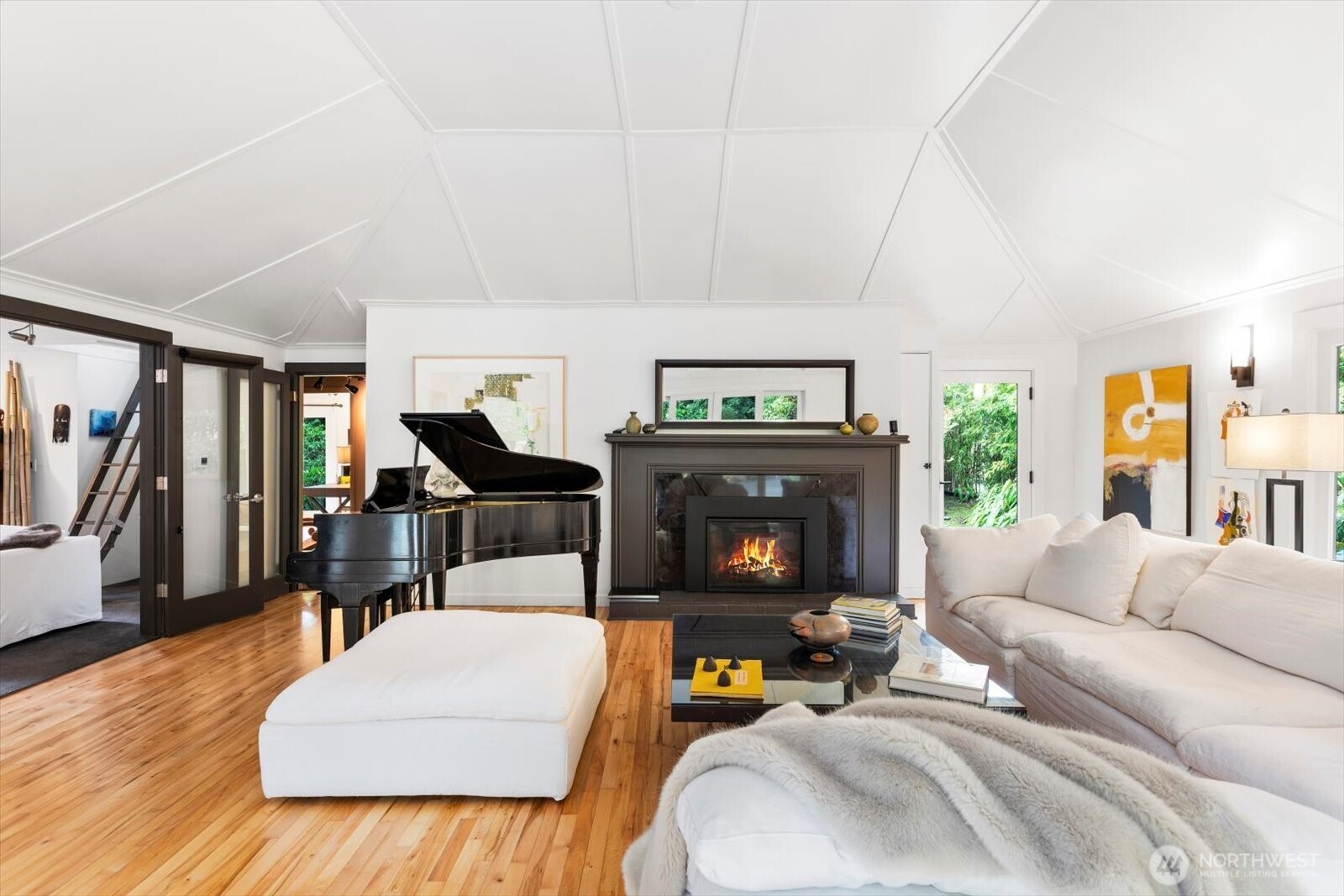 Dramatic yet instantly calming central living room with vaulted ceilings and gas fireplace; wired for sound. Home features Architectural A series Anderson windows throughout.