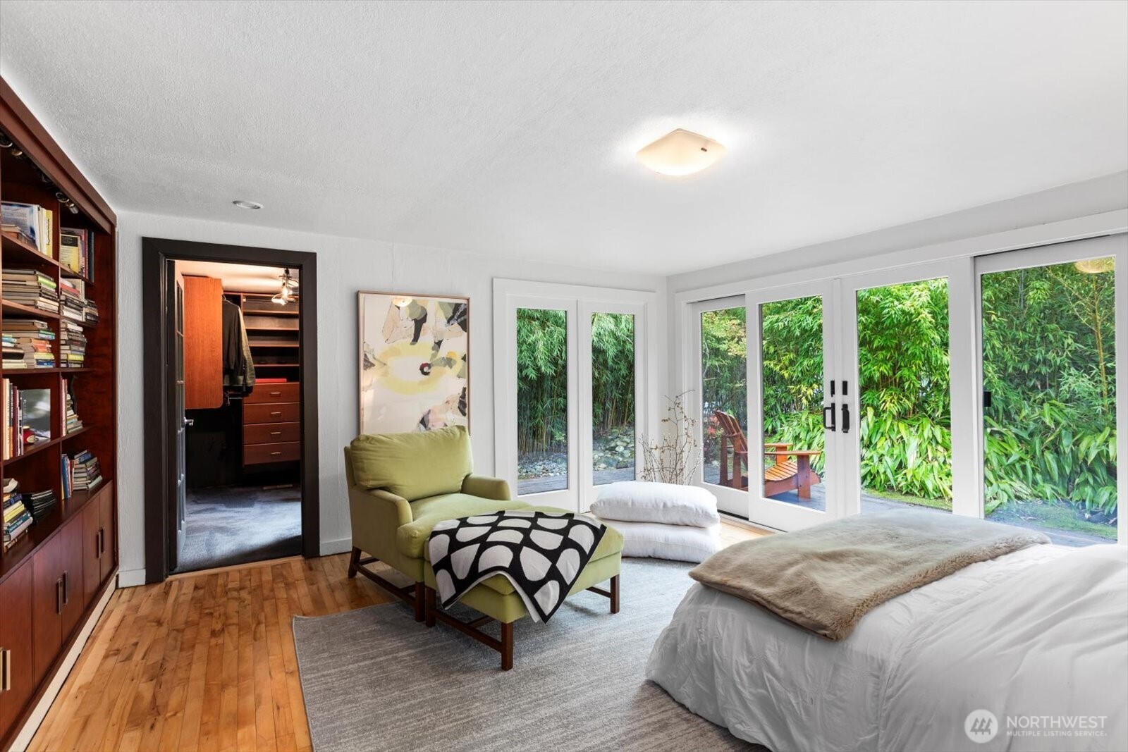 Primary bedroom oasis with access to your own Zen garden, walk-in closet plus additional cedar lined closet.