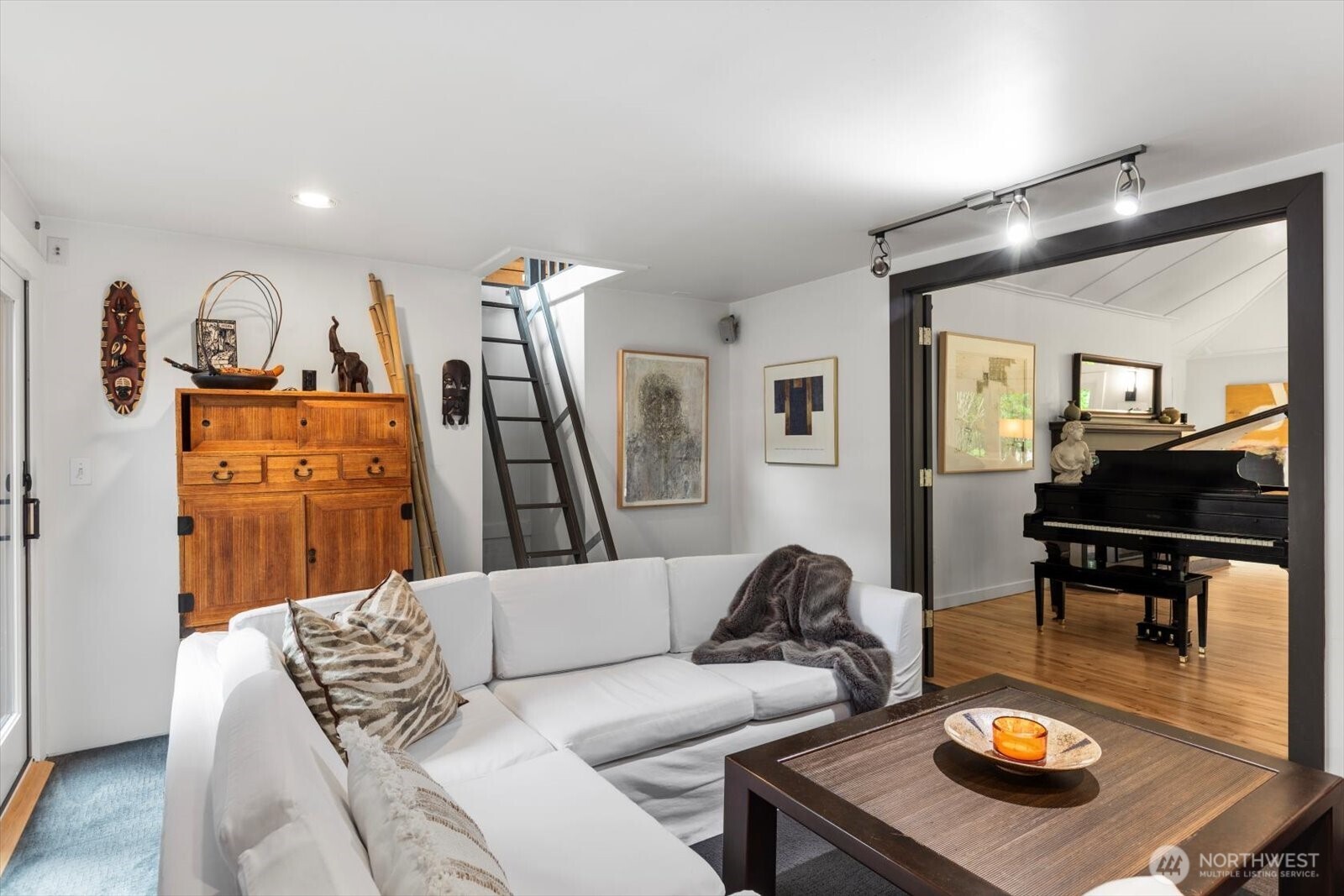 Bedroom with loft space, currently used as a den. French doors for privacy as desired.