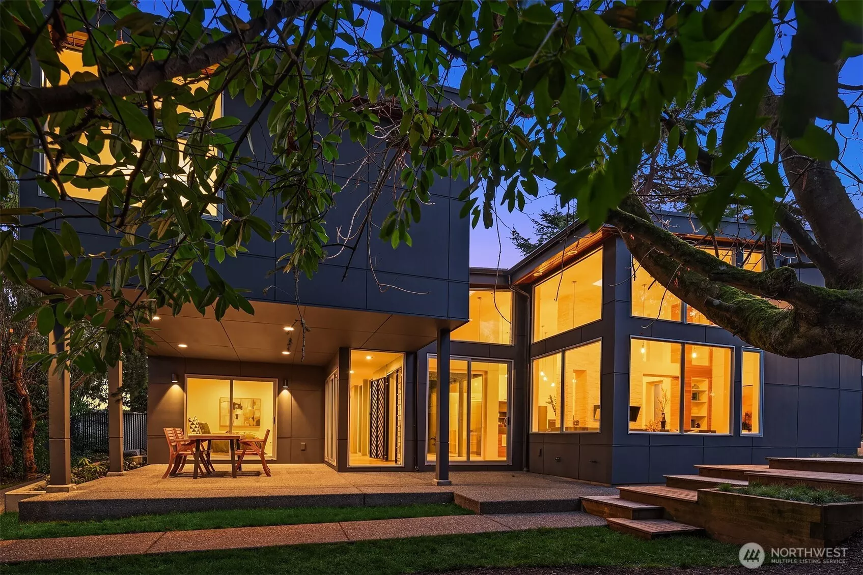 A Modern Boho Sanctuary in the Heart of the City! Step through the steel-framed gate with salvaged ship porthole, and you're immediately transported into a hidden courtyard, a secret oasis where lush greenery and architectural elements set the tone for the home’s serene ambiance.