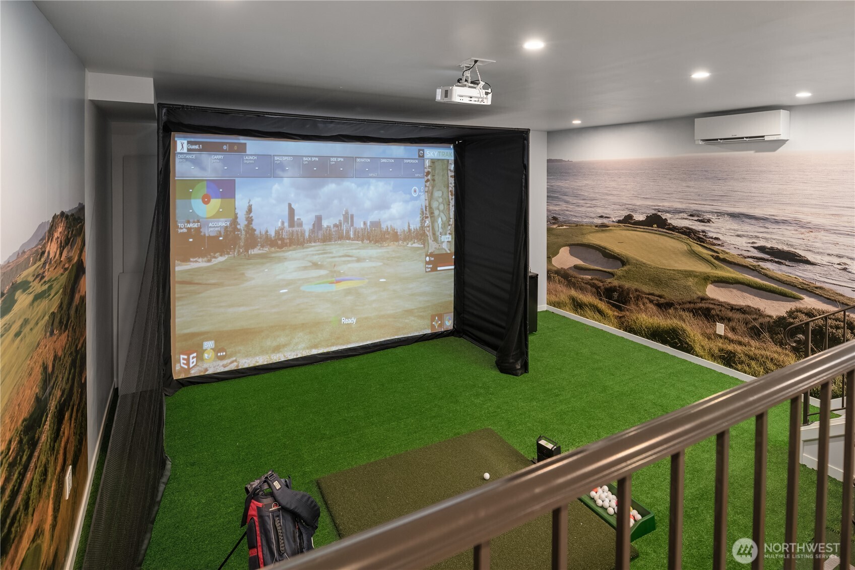 And if all the above was not enough...there is a state-of-the-art golf simulator in the lower level! Ten foot ceilings and stadium seating (behind the railing in this photo). On one wall is the 7th hole in Pebble Beach and on the other, hole #13 at Bandon Dunes. SO. MUCH. FUN!