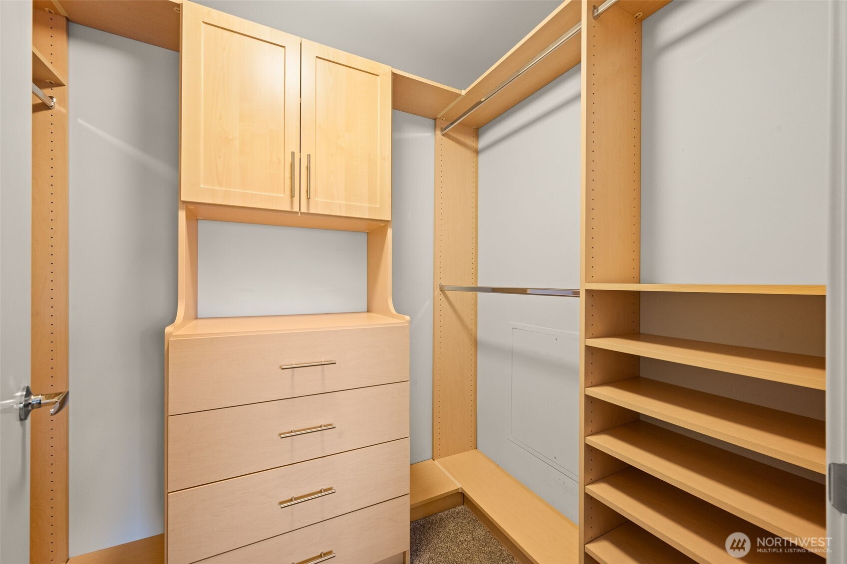 The custom closet system creates so much space for all your wardrobe needs.