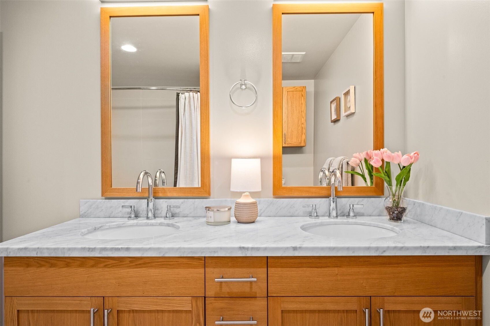 You can see a reflection of the storage cabinet installed above the commode.