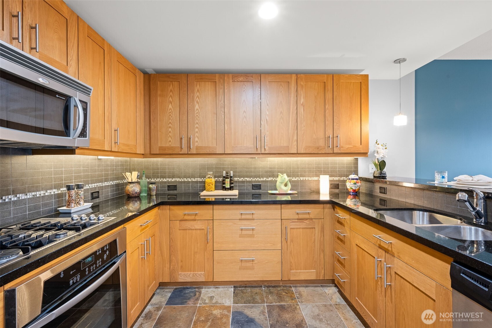 There is an abundance of counter and cabinet space here.