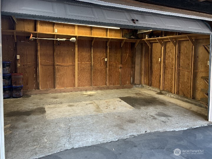 The garage door open from the patio. Will you park in the garage or work on projects? Set up a buffet of food for a party here? Set up some furniture to watch the game? More options for you to decide how to use the various spaces of this home.