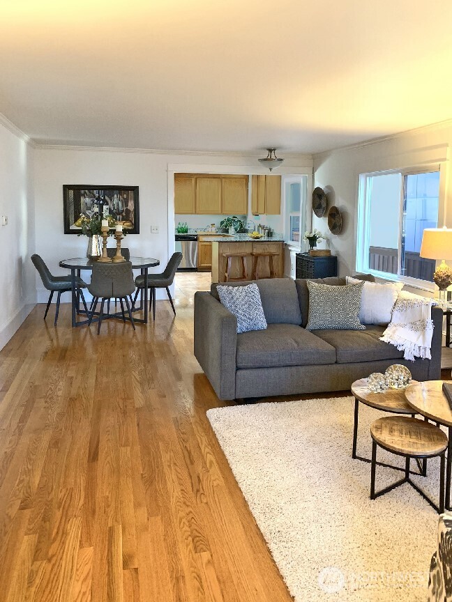 Another angle of the open living, dining rooms and the kitchen. If you prefer to eat your meals at the kitchen counter, you could use this whole space as a very large living room, or office and living room. Your choice...