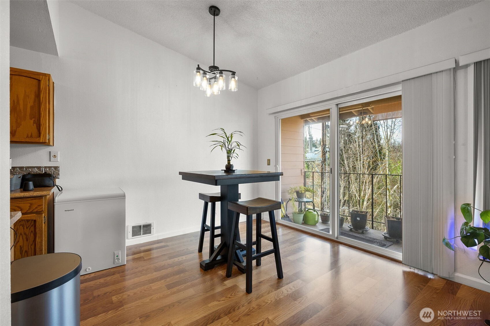 Dinning Room leading to kitchen and private deck