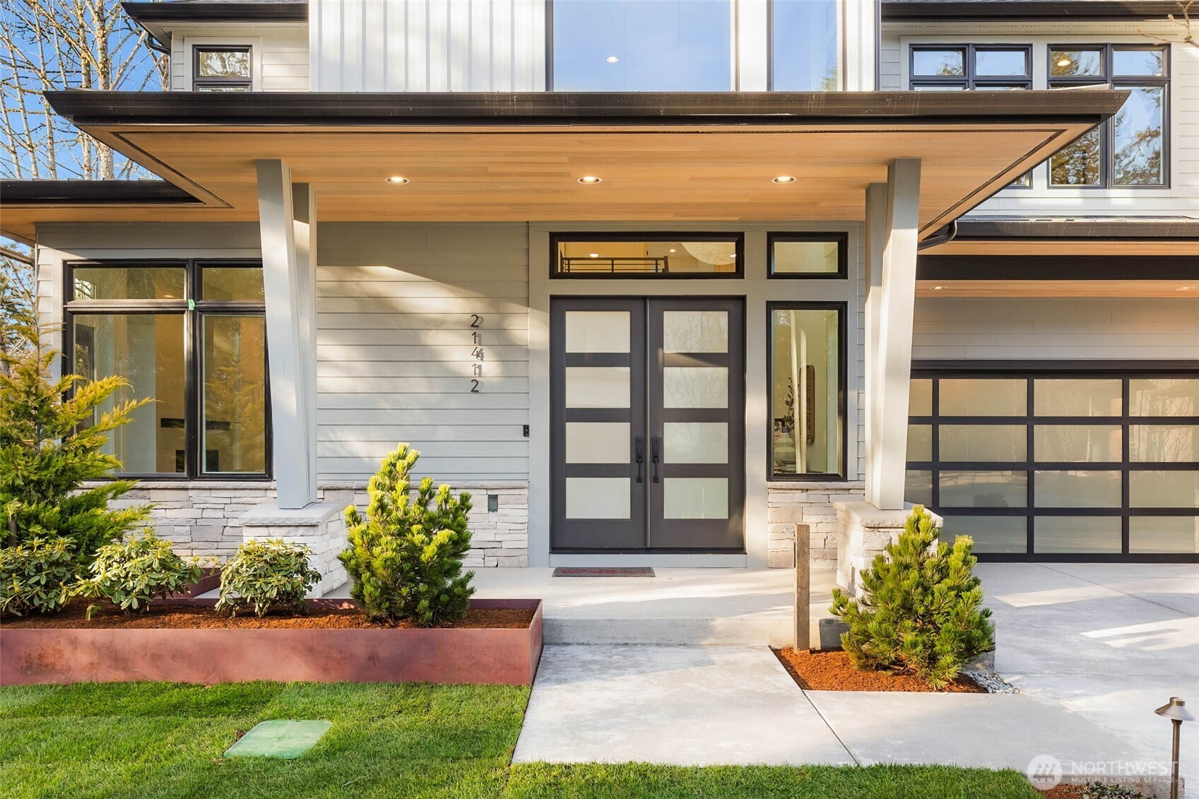 Covered Patio with Cedar Ceiling Detail greets guests with style and sophistication