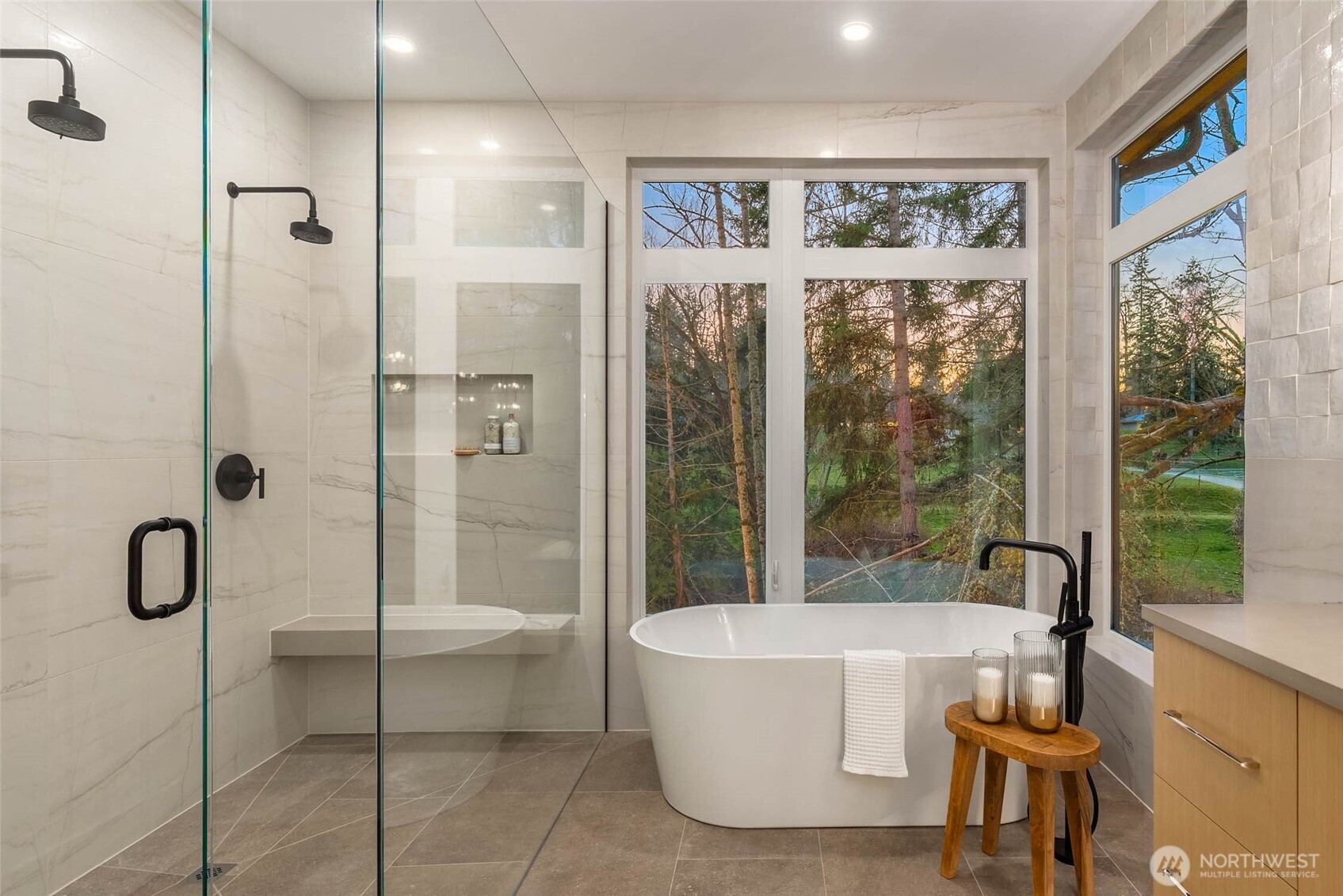 Soaking tub and spacious walk in shower with framless glass surround