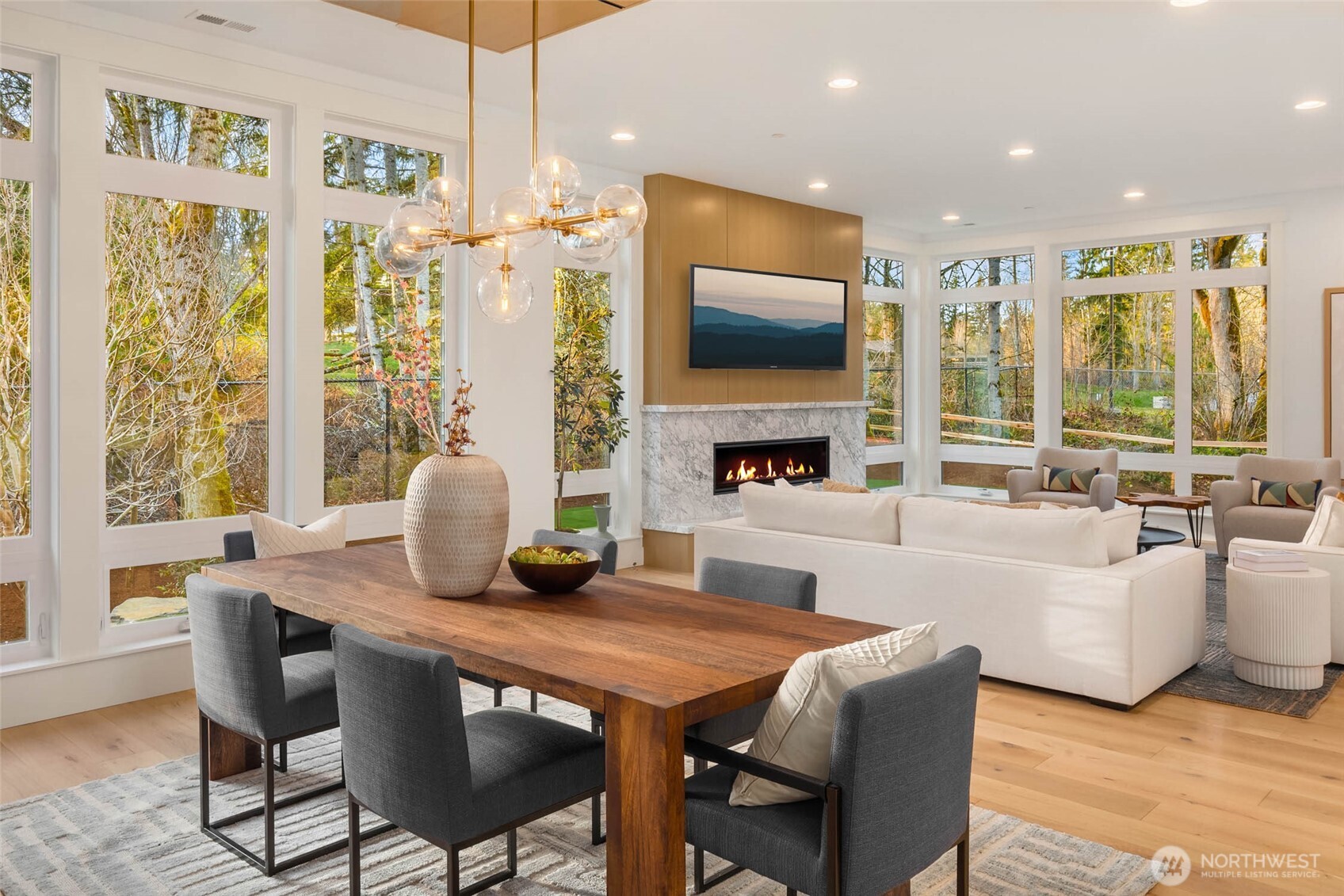 Floor to Ceiling Windows Flood Great Room with Natural Light