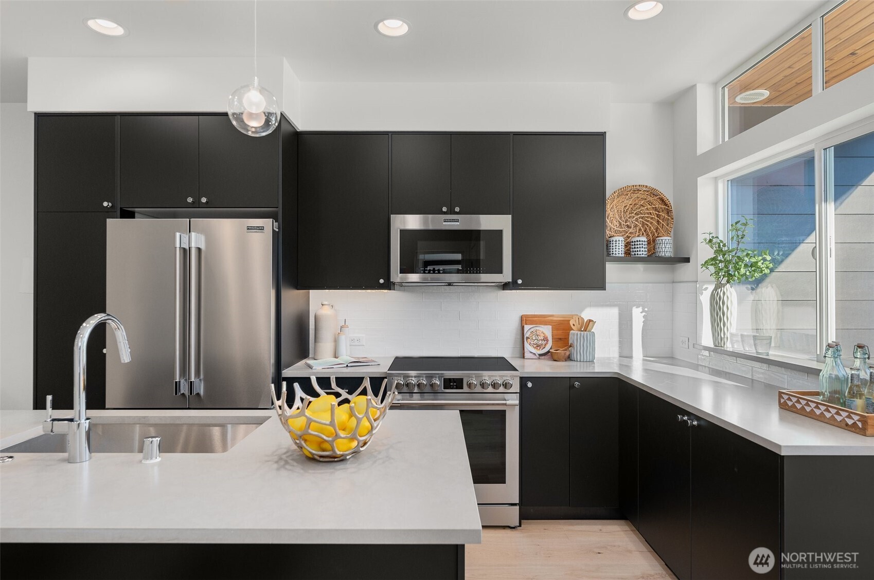 Photos of model home 9213 with similar finishes & floor plan. Clean lines, tons of counter space, and premium finishes make this kitchen as functional as it is photo-worthy.