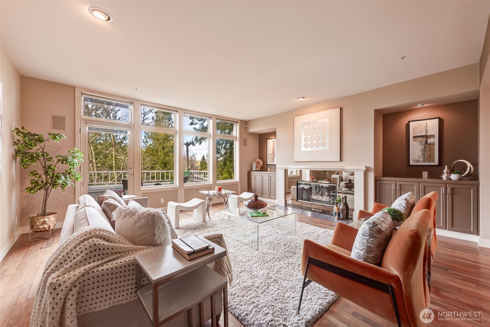 Generous sized living room, complete with gas fireplace and built in cabinetry for extra storage. Westerly views.