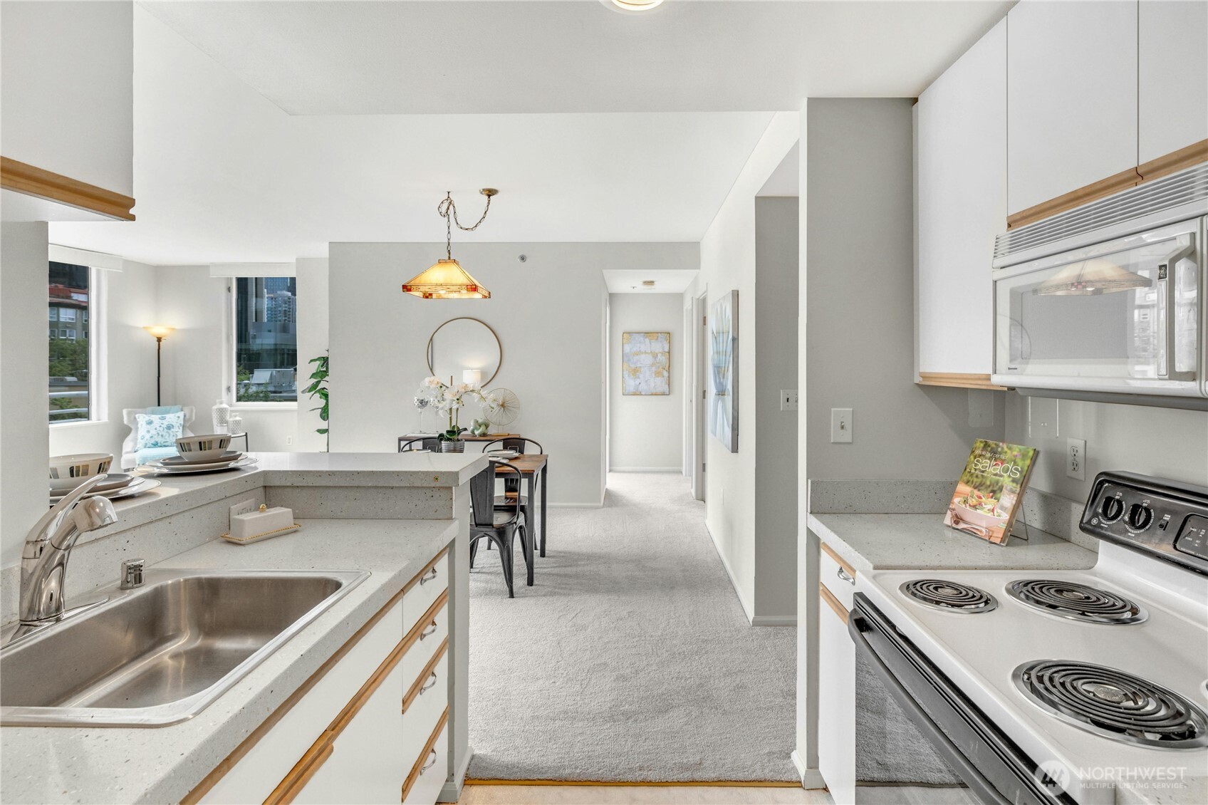 Kitchen view, looking towards living space and bedrooms.