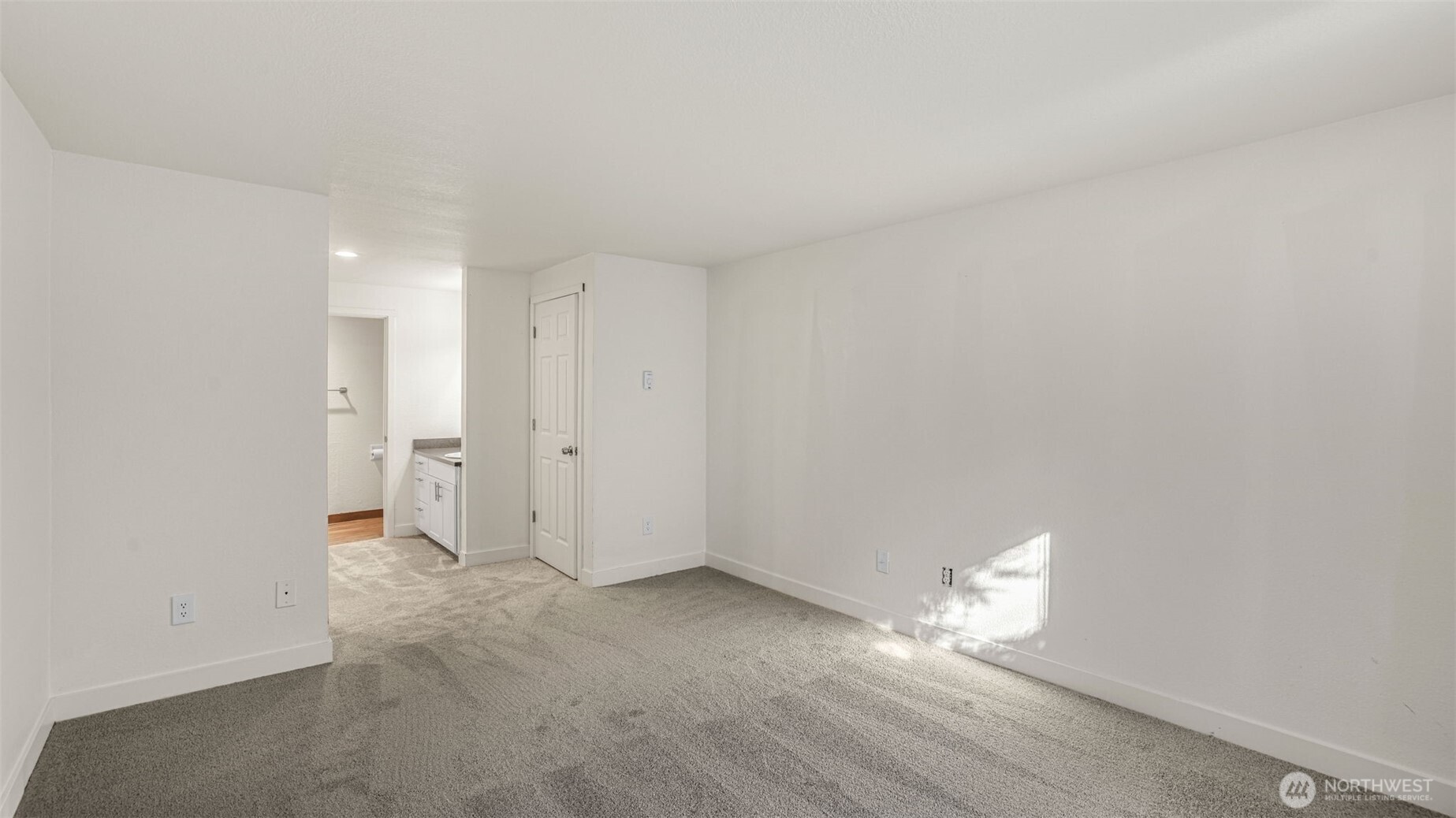 Adjacent to the guest bedroom is your spacious Primary Suite.
