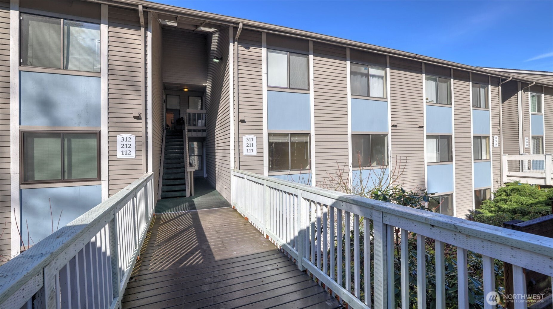 Unit R112 is a desirable end unit, conveniently located on the lower level for easy access.