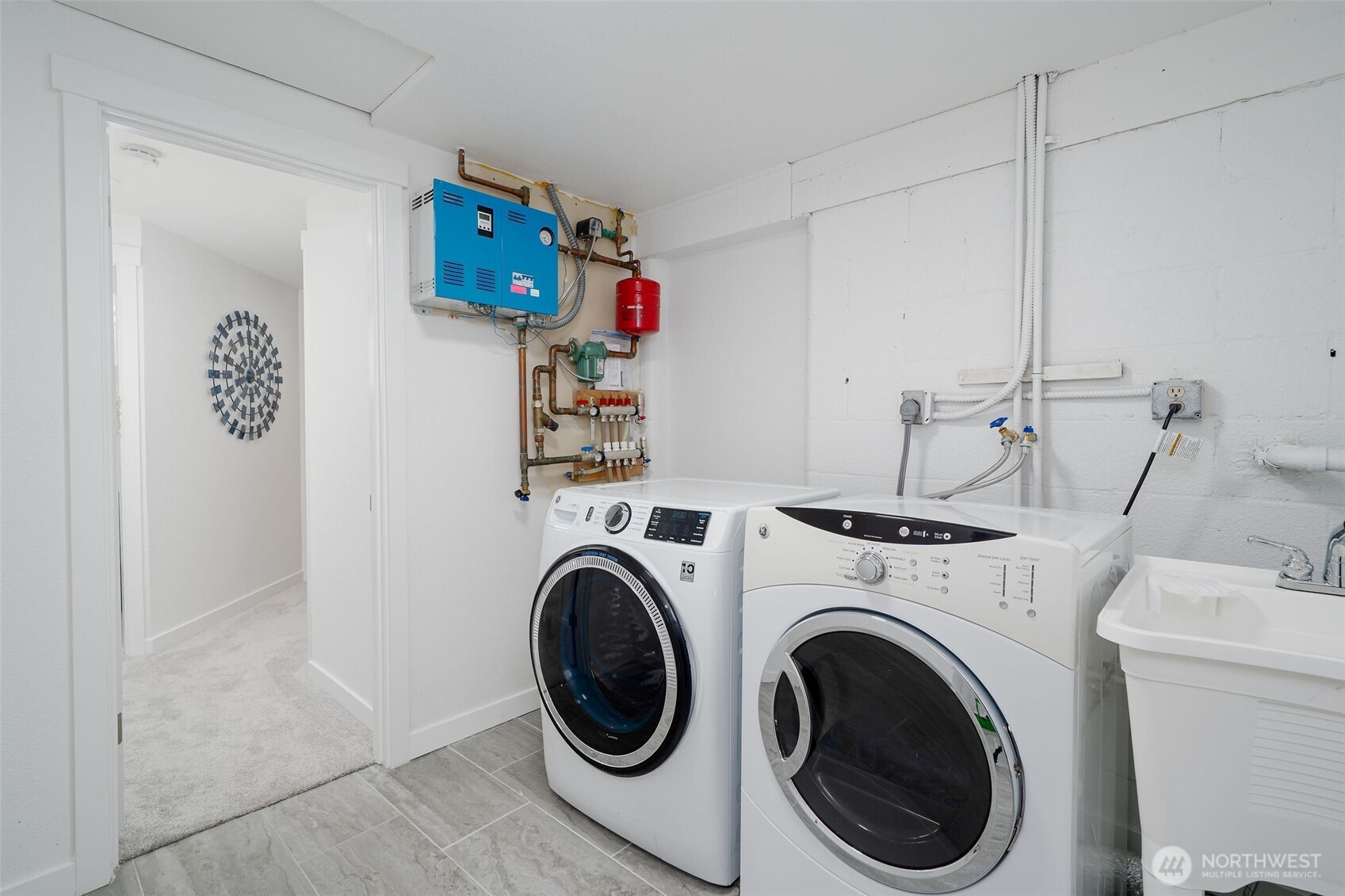 Washer & Dryer Convey, on the wall is the Radiant Heating for the entire home