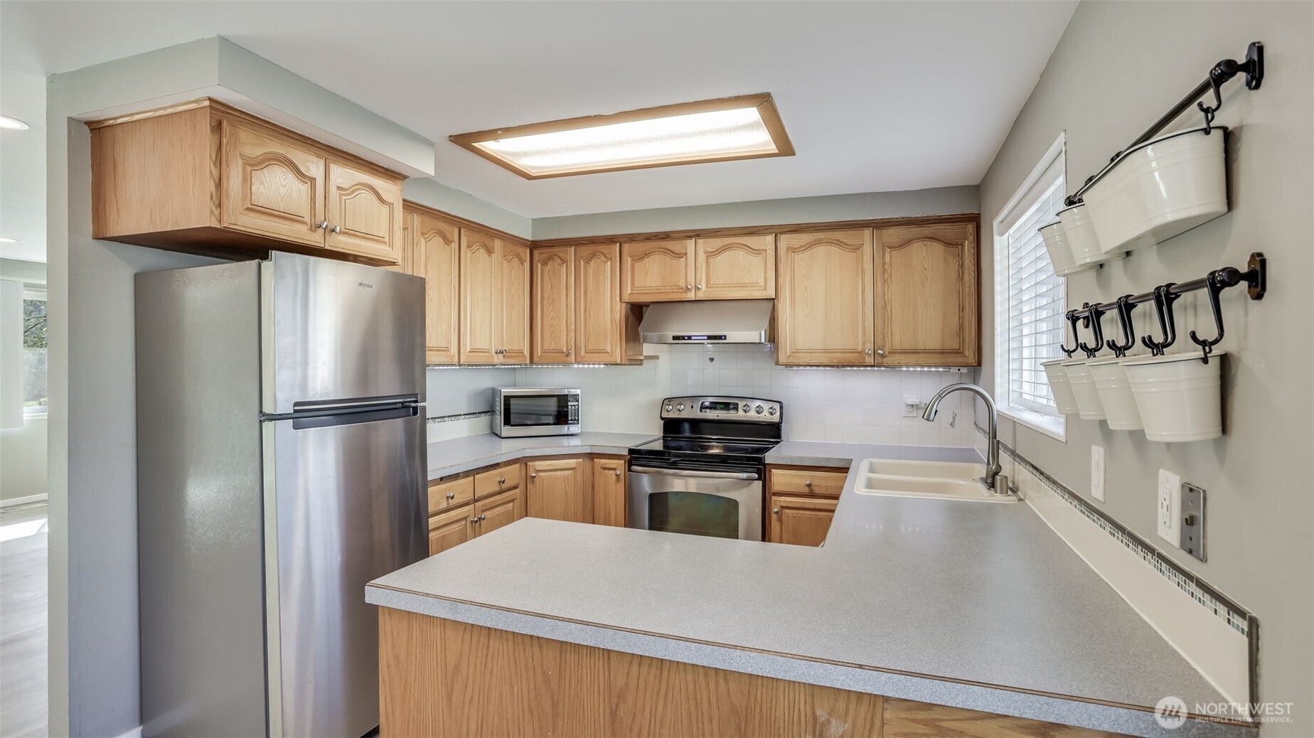 Kitchen provides ample cabinet space and all appliances stay, great as the heart of your home or the perfect breakroom during the work day.