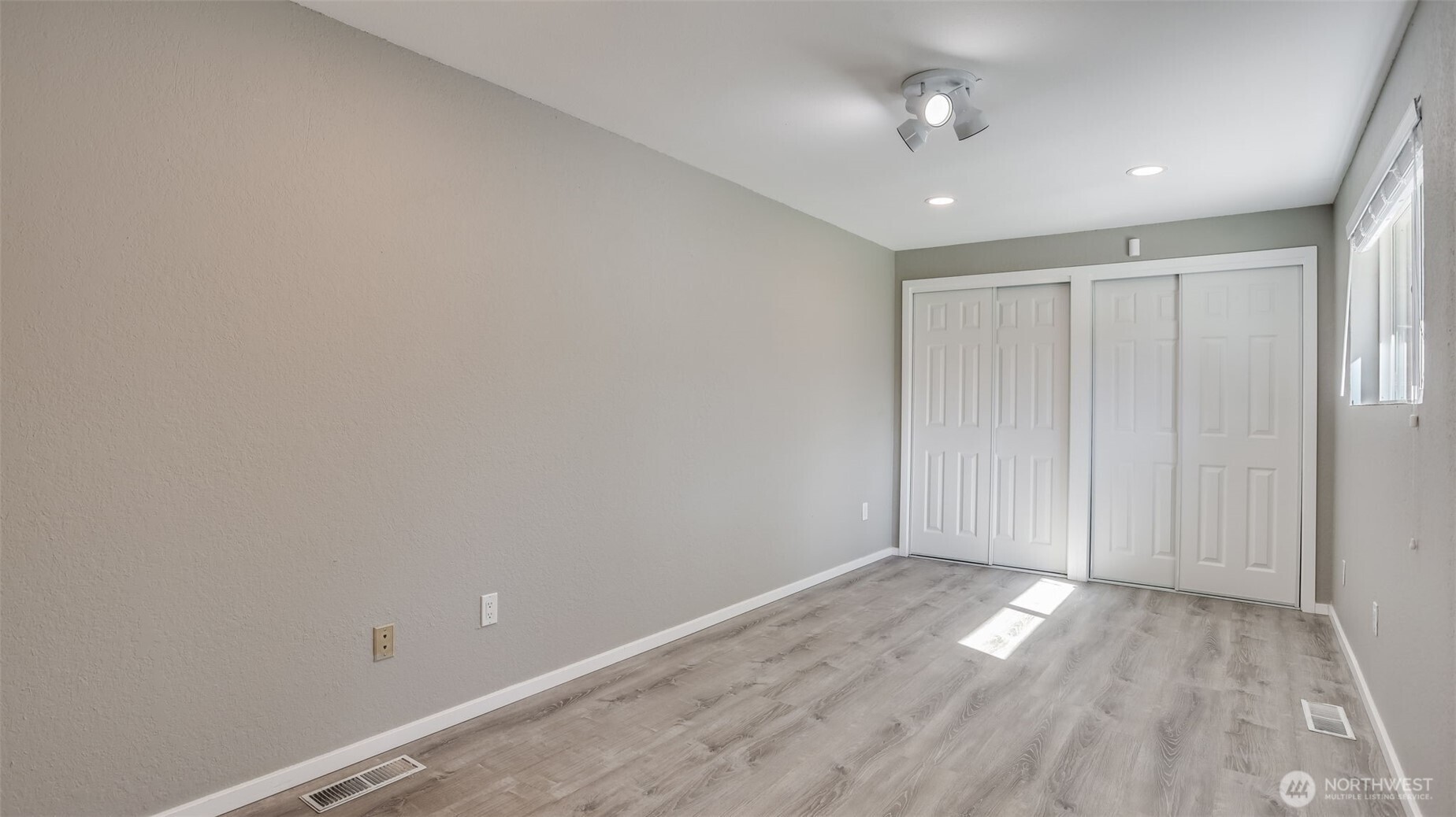 One of the three spacious guest bedrooms with double closets.