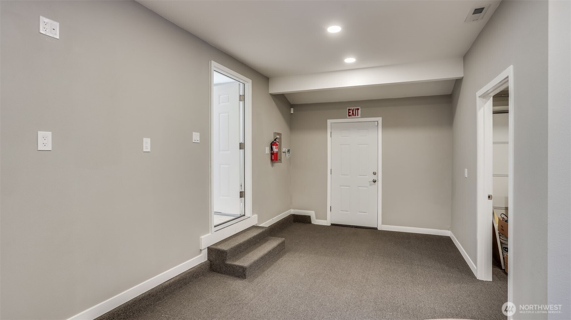 Part of the garage was converted into this space, ideal for additional storage, conference room, play space, gaming area, etc.
