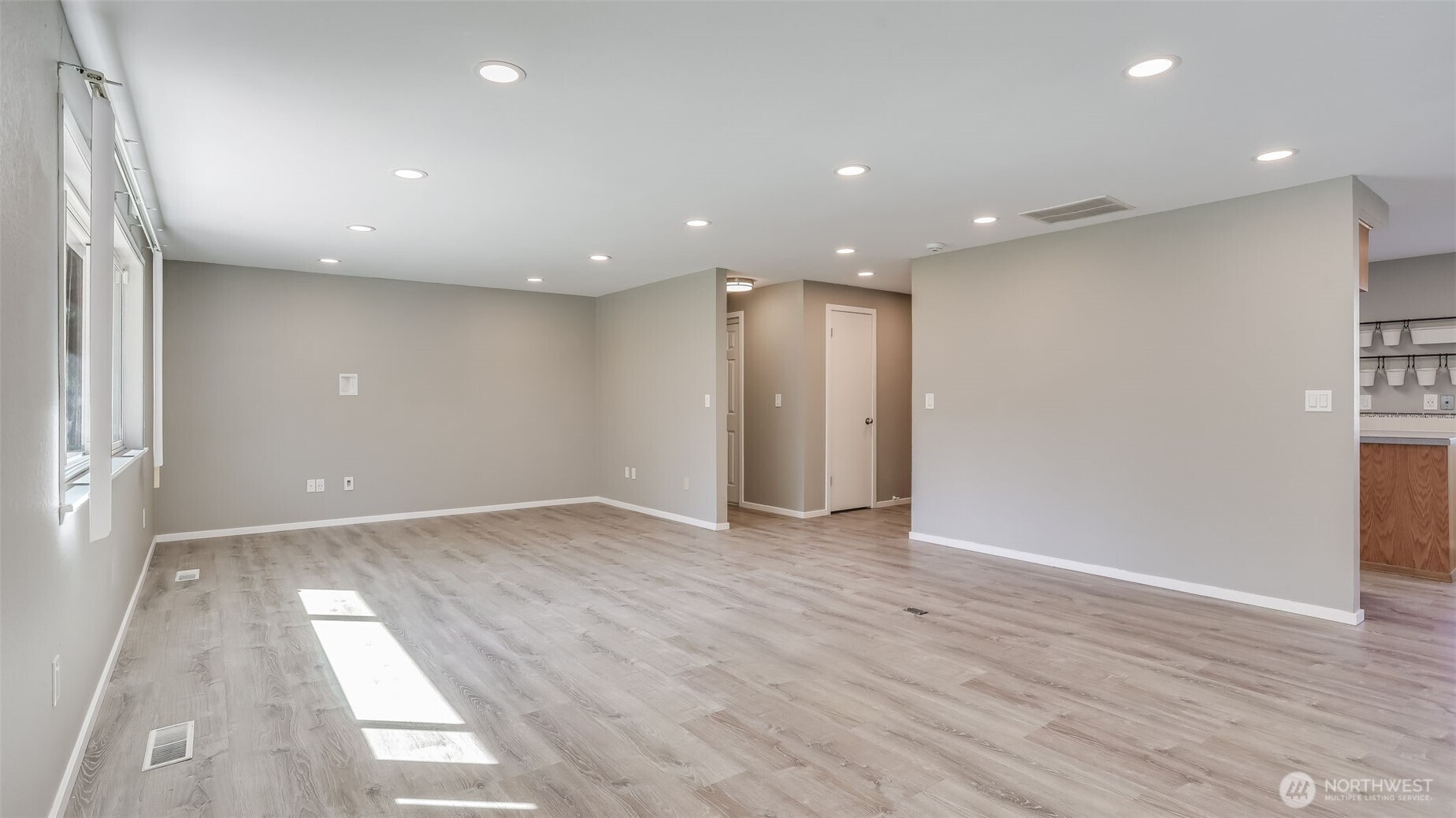 This great room flows seamlessly to other parts of the home with modern LVP floors flowing throughout.