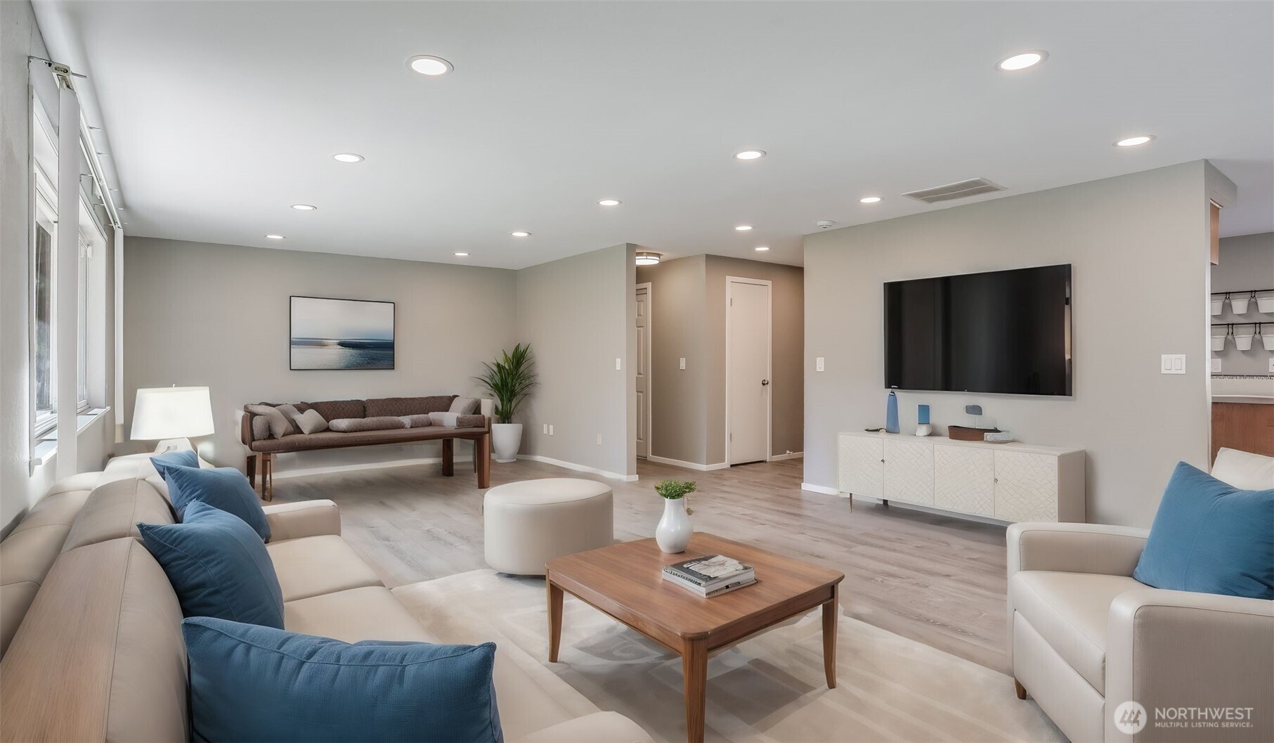 Enjoy this home as a residence with this space set up as a cozy living room, virtually staged.