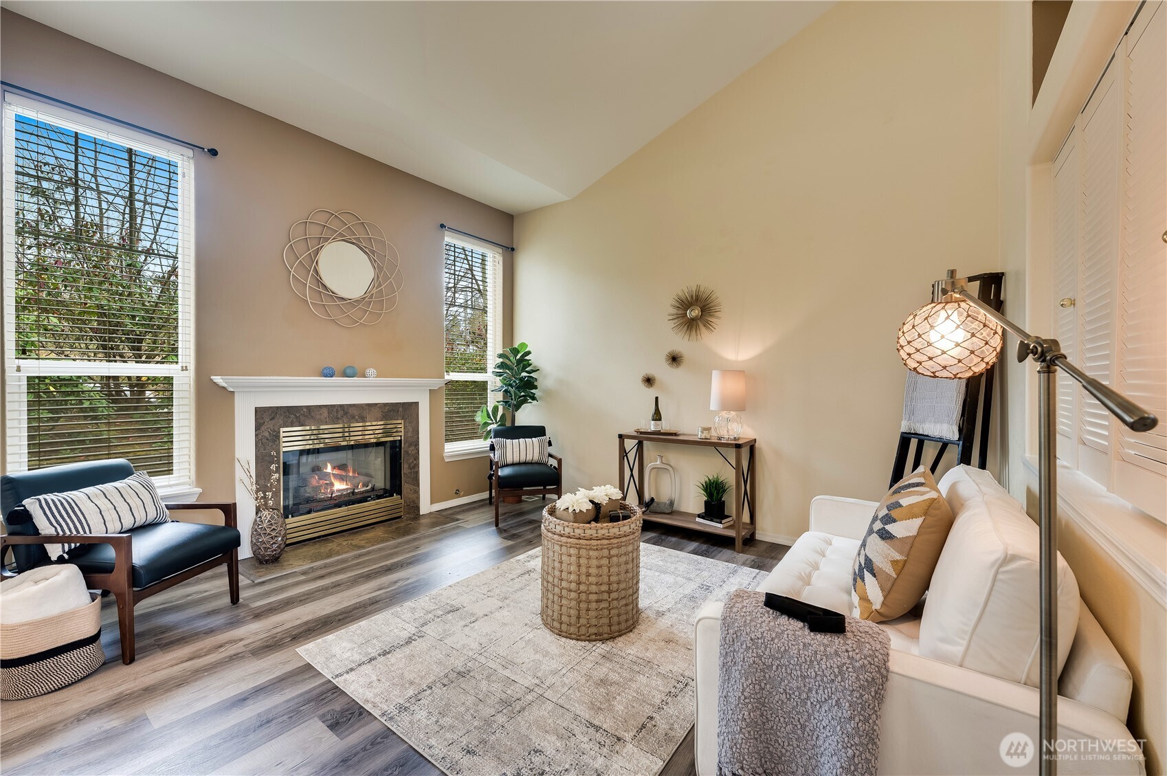 Spacious living room with cozy gas fireplace and lots of natural light