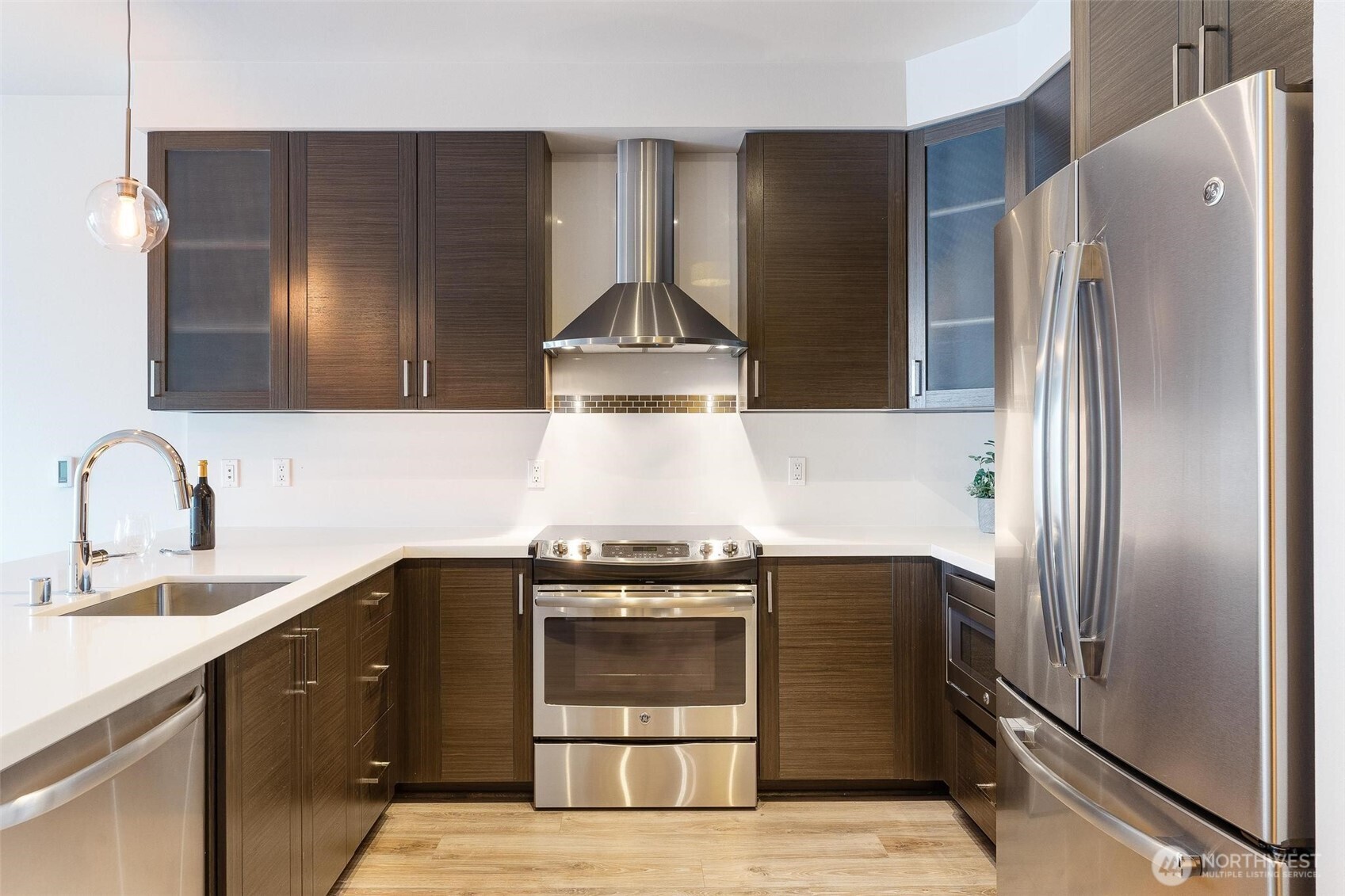 Spacious Kitchen with Espresso cabinets and quartz counters