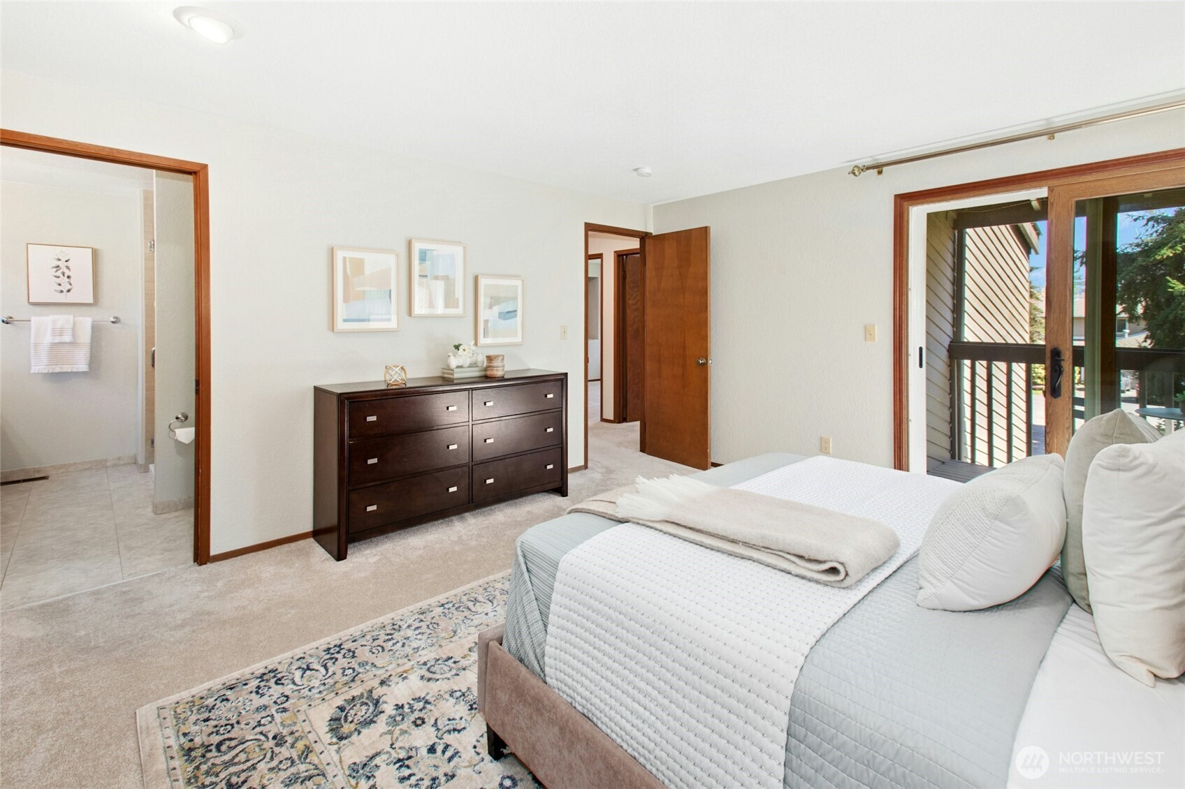 Primary suite with access to a private, covered deck — perfect for morning coffee