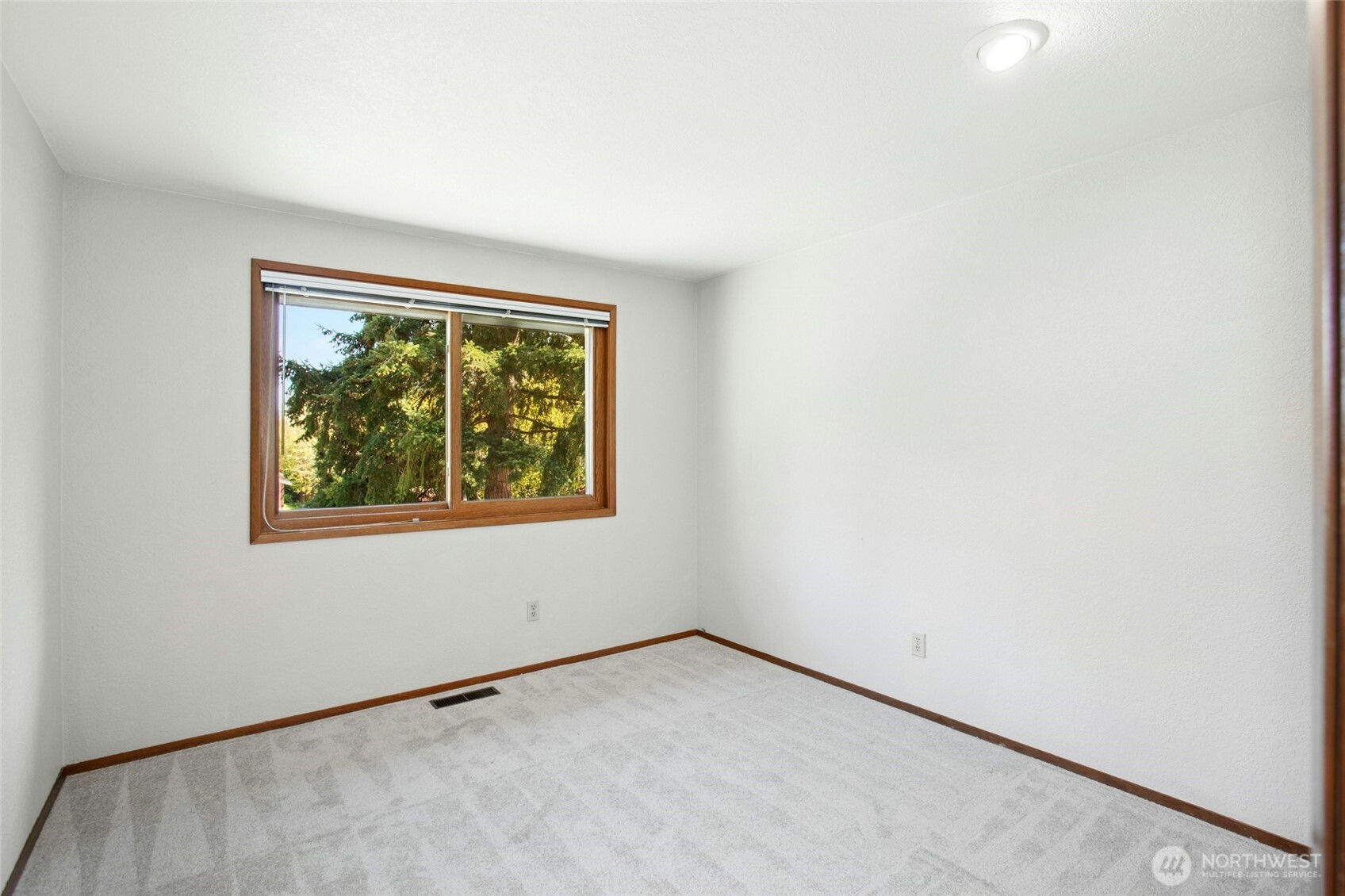 Another well-appointed secondary bedroom on the main level