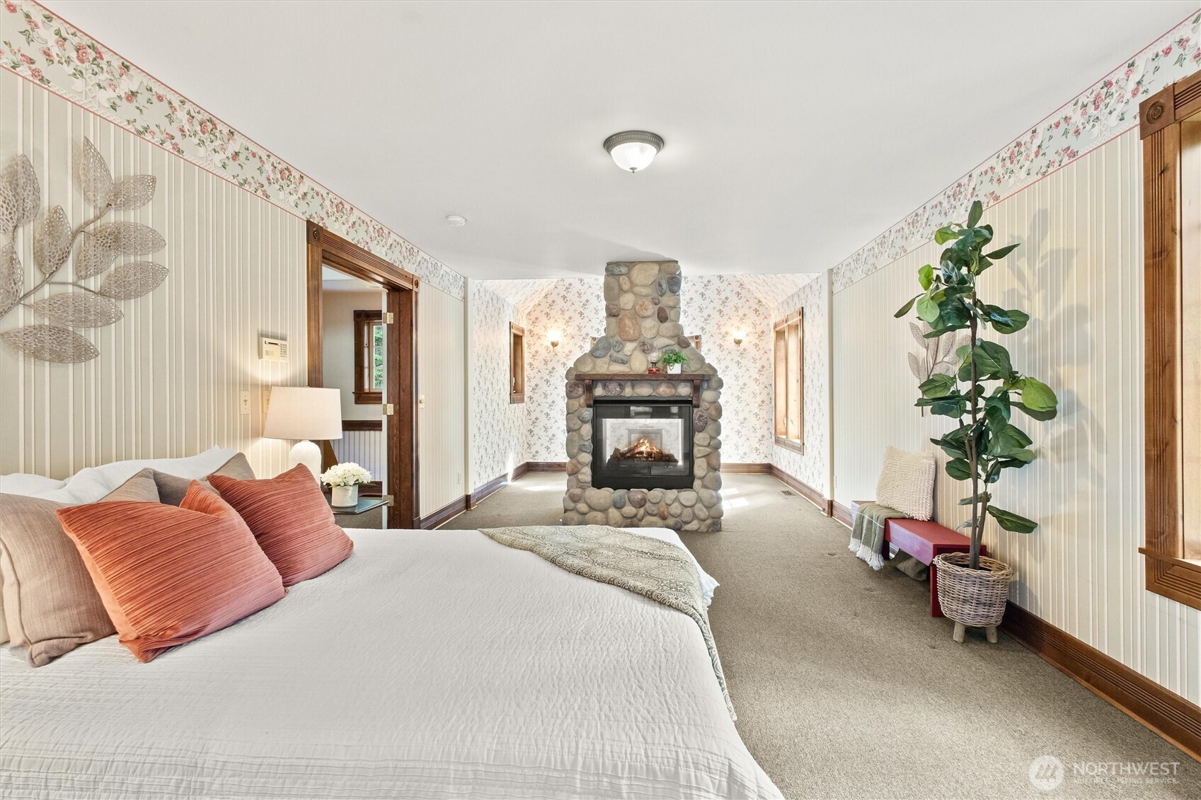 Large Primary Bedroom with two-sided fireplace.