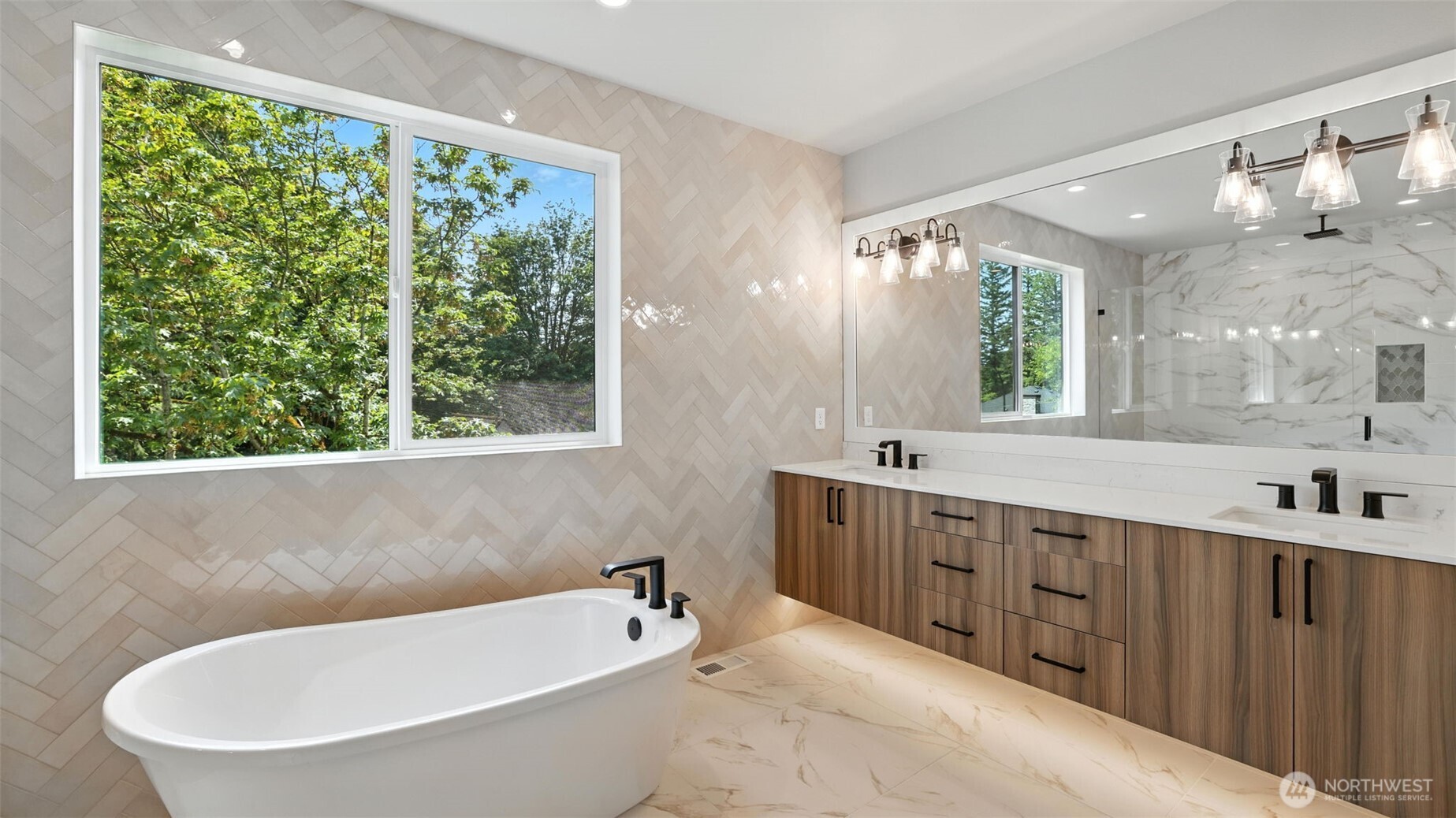 Sumptuous Primary 5-Piece Bath, featuring heated tile floor, floating double-sink vanity, soaking tub and rain shower head.