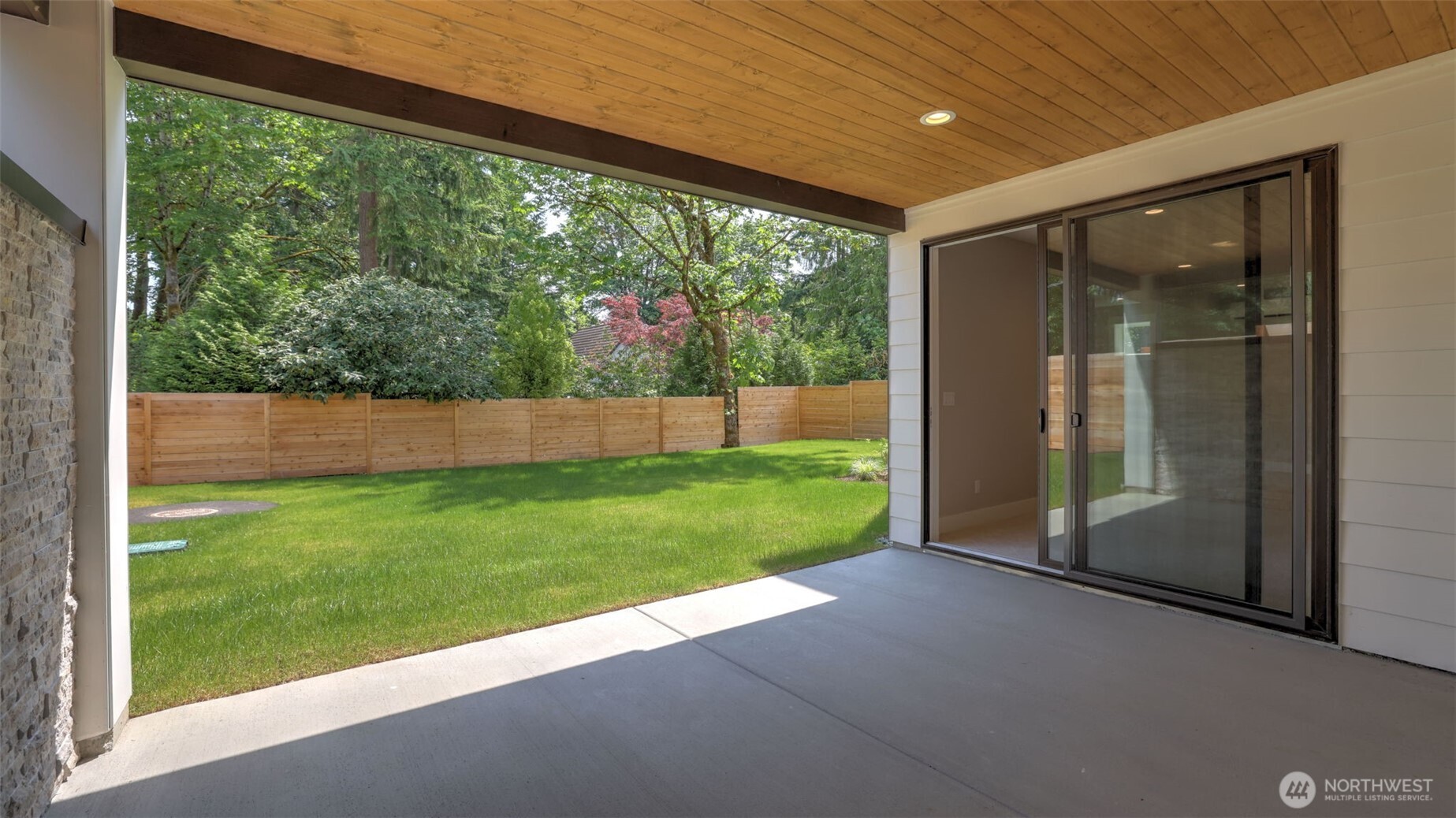Step out from the Lower Level Rec Room to your covered patio and large, leveled backyard!